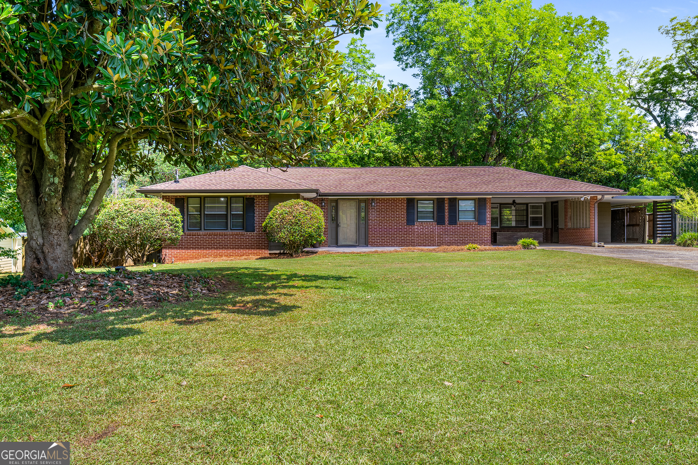 CALLING ALL DIYers - Incredible opportunity to purchase a "fixer upper" with a separate heated and cooled +400 sq ft accessory building on a large (.75 acre) level lot with a private backyard. Property is offered "AS IS" - build immediate equity by making your own updates/upgrades! House is a mid-century (1956) 3BR/2 BA all-brick ranch with hardwood floors, an open concept kitchen with views to the dining and living rooms and an enclosed sunroom overlooking the private backyard. Home sits on a LARGE (.75 acres) LEVEL LOT. Roof on house and the detached accessory building were both replaced in 2023. This is the best investment opportunity within 5 miles!