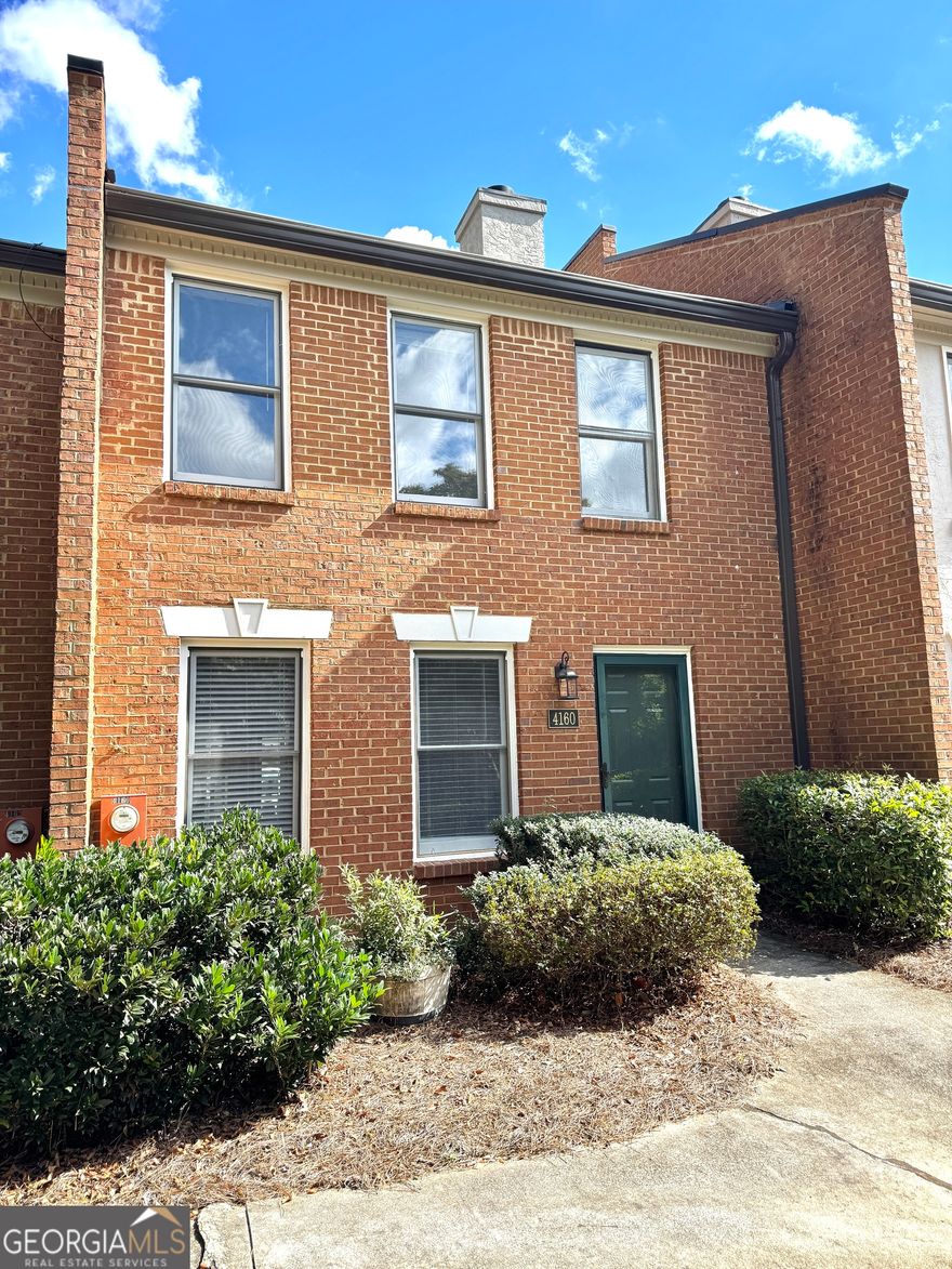 Move right into this updated 2-bedroom, 2.5-bath townhome-perfect for any buyer or investor. The exterior features two-sided brick front and back for added curb appeal. Inside, enjoy new LVP flooring, tile in the kitchen and dining area, and fresh interior paint throughout. The spacious living room flows into a cozy dining area, creating a warm and open feel.  The kitchen boasts luxury soft-close cabinets, granite countertops, and mint-condition appliances. Upstairs, you'll find two generously sized bedrooms, each with its own private full bath.  A 2-car covered carport at the back provides direct access for easy parking. The HOA covers landscaping, roofing, and trash service-giving you more time to enjoy life. Rentals are allowed!  Community amenities include a pool, tennis courts, playground, picnic area, private lake, and scenic walking trails. Conveniently located just minutes from Downtown Duluth, Target, Whole Foods, Starbucks, LA Fitness, and more.  Listing agent is also the owner.