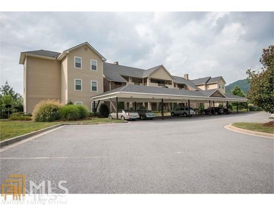 High quality condominium in Kingwood Country Club community.  Quality features include top floor in elevator building, cathedral ceilings, oak hardwood floors, crown molding, granite countertops, jetted tub and two vanities in master bath, tray ceiling in master bedroom, gas log fireplace with stacked stone, hardiboard, outside storage unit, one assigned covered carport, walk in closets in both bedrooms and attic pull down stairs for additional storage.  Screened in patio (10x23) with access from living room and master bedroom.  Low maintenance fees and reserves funded.