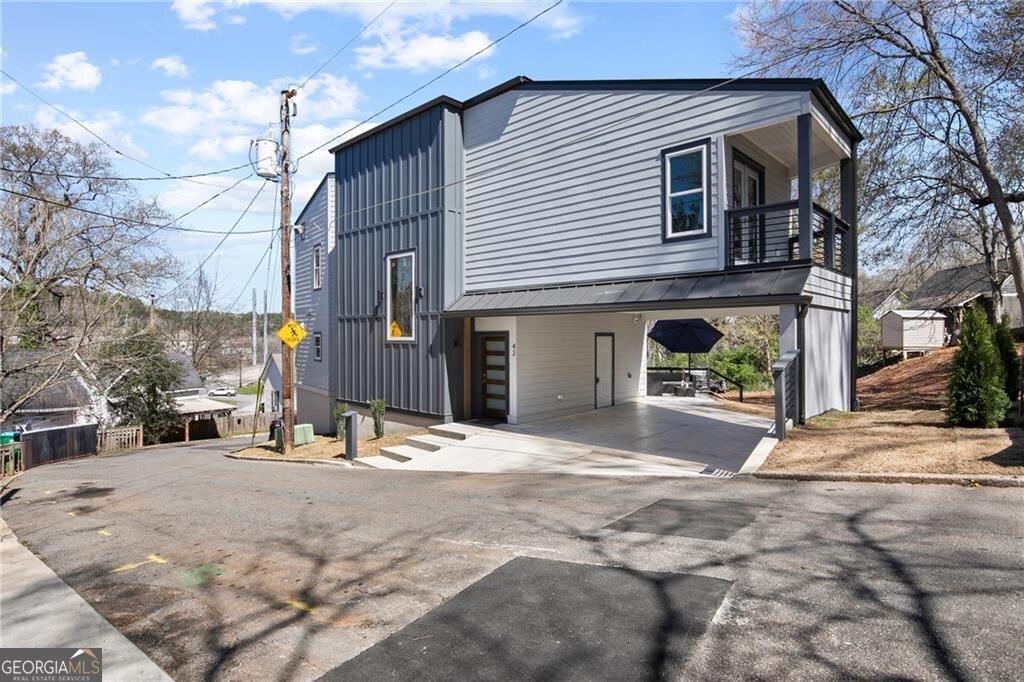 Brand New Modern Home in the Heart of Downtown Canton - 3 Bed, 2.5 Bath 2,212 SF Welcome to your dream home! This stunning brand new 2,212 square foot modern masterpiece offers the perfect blend of luxury, functionality, and style. Featuring 3 spacious bedrooms and 2.5 beautifully designed bathrooms, this home was built with premium finishes and thoughtful details throughout. Step inside to a bright and airy open-concept main level with soaring 9' ceilings, elegant recessed lighting, and a built-in speaker system throughout the home - perfect for entertaining or everyday living. The gourmet kitchen is a showstopper, boasting premium-style cabinets with abundant storage, sleek quartz countertops, and a luxury stainless steel appliance package. The entire home is outfitted with waterproof luxury laminate flooring, adding durability and a seamless modern look. A striking metal cable-style handrail adds a unique architectural touch to the interior. Both full bathrooms are designed to impress with huge walk-in showers and double vanities, offering spa-like comfort in your own home. Located in Downtown Canton, you're just a short walk to charming restaurants, breweries, shops, and all the small-town charm the area has to offer. Plus, you're only minutes from I-575, with the North Georgia Mountains just 20-30 minutes away and Downtown Atlanta within 45 minutes - the perfect balance of city access and natural beauty. Don't miss this incredible opportunity in one of Canton's most up-and-coming areas - homes like this don't last long. Contact the listing agent today for more information!