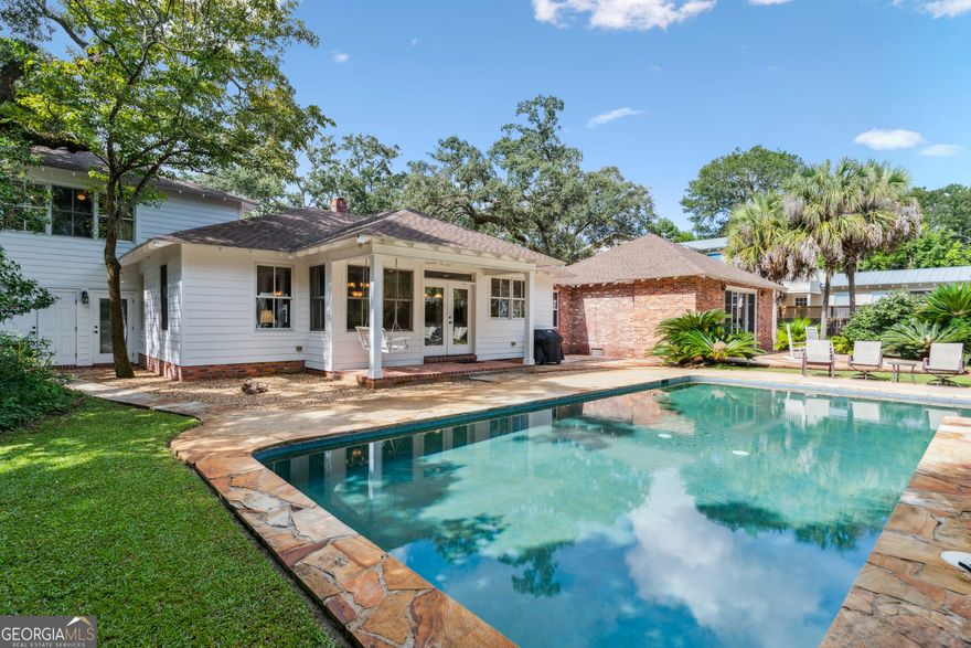 Welcome to 625 May Joe Street, a timeless residence that seamlessly blends Southern charm, historic craftsmanship, and the relaxed elegance of coastal living. Perfectly positioned in the highly-sought after Village area 3 blocks from the ocean, this thoughtfully maintained home offers both character and modern comfort. The main house features four spacious bedrooms and single-level living filled with abundant natural light that creates a warm and inviting atmosphere. A separate apartment above the garage provides endless opportunities-whether for guests, extended family, private office space or as a rental. Separate apartment has a full kitchen, full bathroom, bedroom, full size washer and dryer, living space and flex room that could easily sleep extra guests. The oversized lot ensures both privacy and ample outdoor space with a large lap pool and deck. Two generous living areas offer flexibility, giving everyone room to gather or enjoy their own activities. There is also a private office perfect for those who might work from home. This residence delivers the perfect combination of charm and space within the Village Preservation District-an exceptional opportunity to enjoy island living at its finest. Click here for a full video of the property. https://youtu.be/_3WCf3m5Hbg