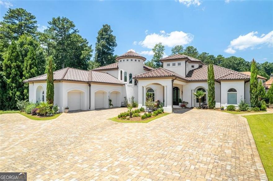 This masterfully designed Mediterranean estate, crafted by its original owner, effortlessly combines timeless elegance with contemporary sophistication and is now being offered for the first time. Set in an exclusive cul-de-sac, you are welcomed through an exquisite grand iron and glass front door leading to an expansive living space adorned with flawless marble floors and striking fireplaces. The open-concept layout flows seamlessly into the resort-inspired backyard, where a captivating pool and spa with limestone decking, meticulously manicured professional landscaping, and an oversized covered balcony create the ideal setting for extravagant entertaining. The chef's kitchen is nothing short of a masterpiece, featuring custom European cabinetry, top-of-the-line integrated appliances, a private scullery, and opulent waterfall-edge countertops. The main level also boasts the serene owner's suite showcasing unparalleled luxury, a refined private office perfect for work or study, and a spacious guest suite with en-suite bath that ensures privacy and comfort. Additional thoughtful touches include a sophisticated office and well-appointed laundry room with custom-built cabinetry. A dramatic curved staircase, framed by an expansive window leads upstairs to three generously sized en-suite bedrooms, including one with a private balcony overlooking the tranquil backyard-each offering a private retreat for family or guests. The lower level features an en-suite bedroom, fully equipped gym (which could easily be converted back to a bedroom), full bathroom, and state-of-the-art home theater. The private elevator services all three levels, and every modern amenity has been meticulously incorporated to elevate your lifestyle. This extraordinary estate presents an unparalleled opportunity to own a flawlessly designed sanctuary where every detail has been thoughtfully curated for the most discerning buyer.