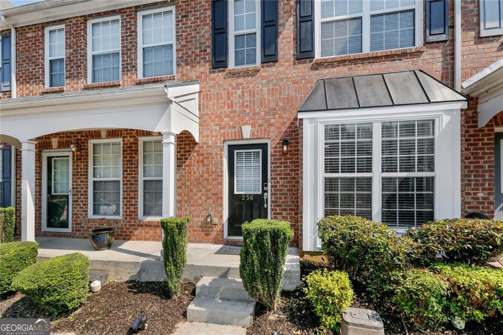 Beautifully updated townhome in the desirable Paden Cove community. This home features an open floor plan filled with natural light, a cozy fireplace, and a modern kitchen with stainless steel appliances and stone counters. Upstairs offers two spacious bedrooms with private baths, including an oversized owner's suite with a walk-in closet, dual vanity, and soaking tub. Conveniently located near shopping, dining, schools, and major highways, this move-in ready home is waiting for you.