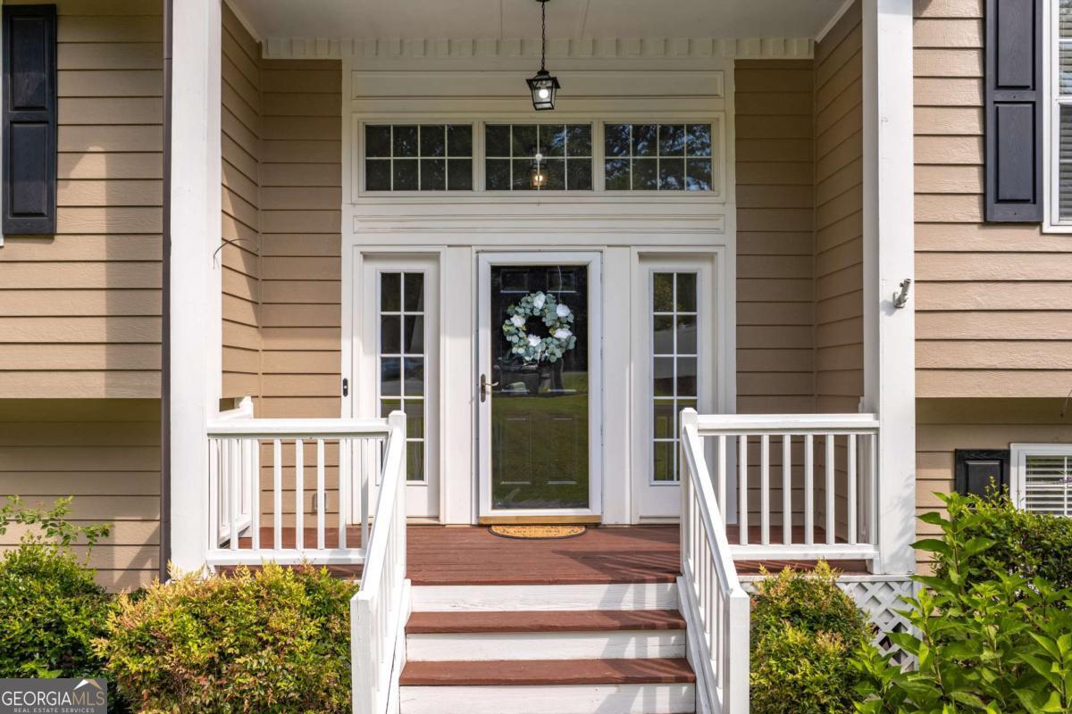 Welcome to this beautifully updated and meticulously maintained home in the highly sought-after Harrison High School District. With over $85,000 in thoughtful renovations and improvements since 2020, this home is truly move-in ready! The owner has taken care of every detail! Enjoy new LVP flooring throughout, freshly painted walls, ceilings, and trim, refinished oak stairs, updated LED lighting and stylish Ballard Designs chandeliers. The reimagined open-concept layout between the living room and kitchen enhances the flow and feel of the main living areas. The kitchen and bathrooms have been tastefully upgraded with new vanities, granite and recycled glass countertops, updated fixtures, new stainless appliances, mirrors, lighting, and elegant tile work. The primary suite features an Elfa closet system and a fully updated en suite with dual sinks, new toilet, and beautiful recycled glass vanity. Additionally closets have been upgraded with IKEA closet systems. The finished lower level offers a versatile and spacious layout, featuring a cozy family room with a whitewashed brick fireplace, dedicated office space, a guest bedroom, full bathroom and laundry closet. The sliding glass doors lead to the fully fenced back yard making this level perfect for multigenerational living, remote work, or entertaining. Enjoy outdoor living with freshly stained decks, a rebuilt fireplace exterior, privacy fencing, French drains, and a pet-friendly setup with dog and cat doors. The landscaped yard is a gardener's dream with strawberries, pumpkins, wild blackberries, hydrangeas, knockout and climbing roses, butterfly bush, azaleas, camellia, lavender crepe myrtle, and more. With all major systems serviced and so many thoughtful upgrades, this home offers peace of mind, convenience, and beauty - all in a fantastic location near top schools, shopping, and parks. Don't miss your chance to own this turnkey gem!
