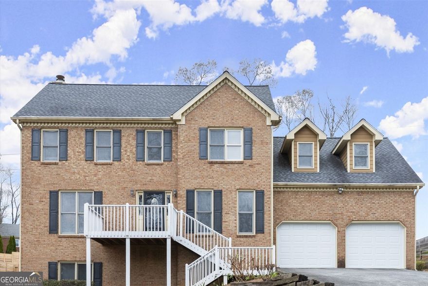 DON'T MISS this lovely home located in the highly desirable East Cobb Blackwell Chase subdivision. Boasting 5 bedrooms and 3.5 baths, this home offers a perfect blend of space, style, and functionality. The main level features hardwood floors throughout, a large dining room perfect for entertaining, and a versatile living room that could be used as a home office. Relax in the oversized family room with a cozy fireplace, or step outside onto the expansive deck overlooking a flat, private backyard. The upper level features a large primary bedroom and ensuite bathroom with double vanities, jetted tub, separate shower and his and hers walk in closets. Three large additional bedrooms with lots of closet spaces and a bathroom. The fully finished, self-contained basement is a standout feature. Complete with a full kitchen, living room, bedroom, bathroom, an additional room ideal as an office, exercise room, or another bedroom, plus large bonus room that can be used as a walk in closet, craft room or office space. It is perfect for an in-law suite, a college student, or even as a potential Rental Space For Extra Income. Updates, include a new garage doors and newer stainless steel appliances. With its convenient location and thoughtful layout, this home offers everything anyone needs and more.  No  HOA.  Swim membership can be purchased at Blackwell Bend subdivision.