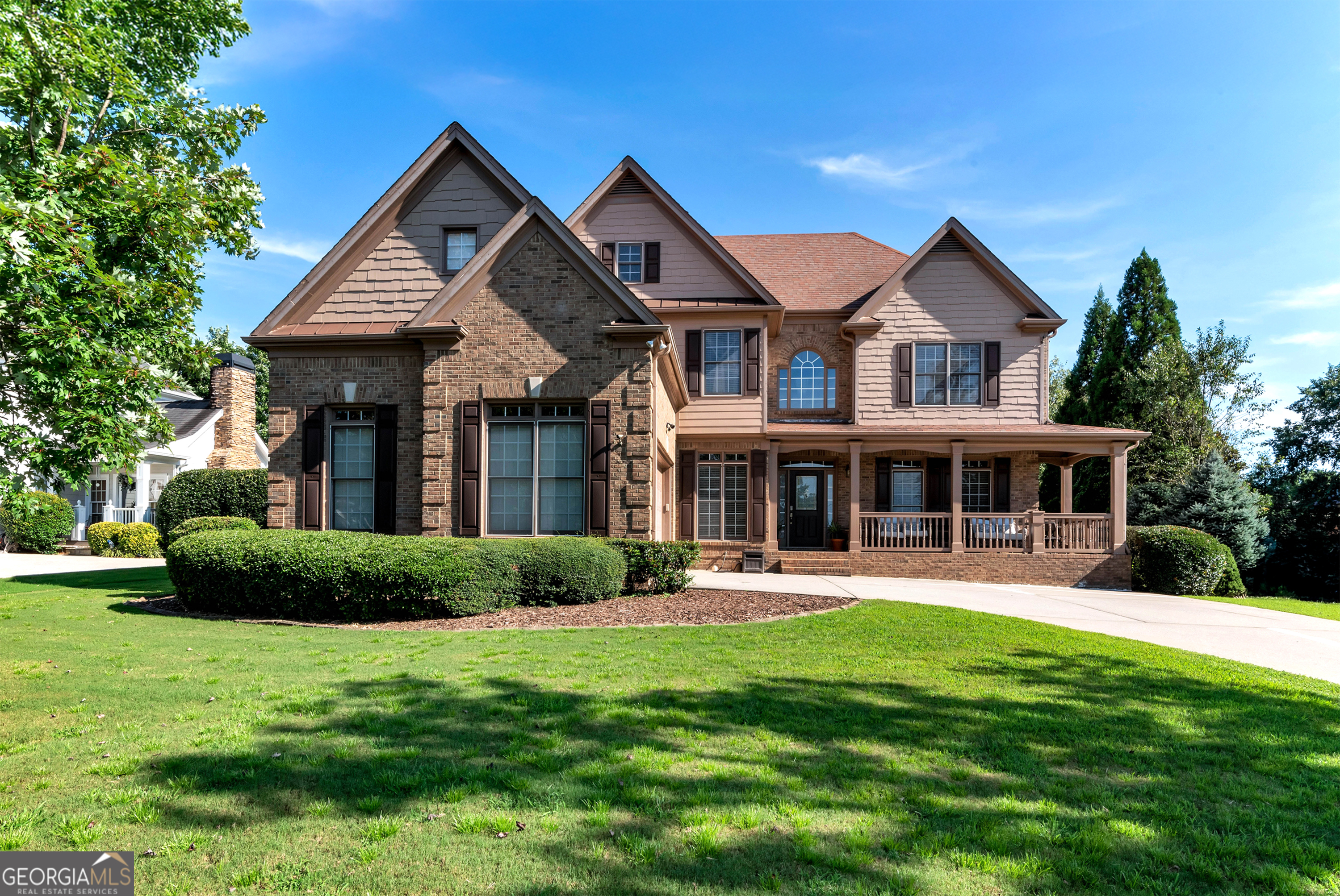 Located in the highly sought after Hedgerows Subdivision. This craftsman styled custom built home boast 6 bedrooms and 5 and half baths. The home features an in-ground pool, finished daylight basement with in-law suite/apartment, full bath with shower and walk in tub, half bath and full kitchen plus a home theater with wet bar. The owner suite provides a large walk around closet with laundry shoot, soaking tub, separate shower and double vanity. The open floor plan kitchen, with breakfast bar and eat in area with a view of the family room with fireplace, and cathedral ceilings. Front entry 10ft high ceiling, office with double doors for privacy, dining room, laundry room and guest room with full bath. Front porch, back deck and patio and pool, with outside bar, for outdoor living. This home checks all the boxes. Conveniently located near community clubhouse, playground, tennis/ pickleball, basketball and soccer field. Excellent schools, minutes from the Mall of Georgia, shopping and restaurants this home is a must see! Seller motivated to sell.