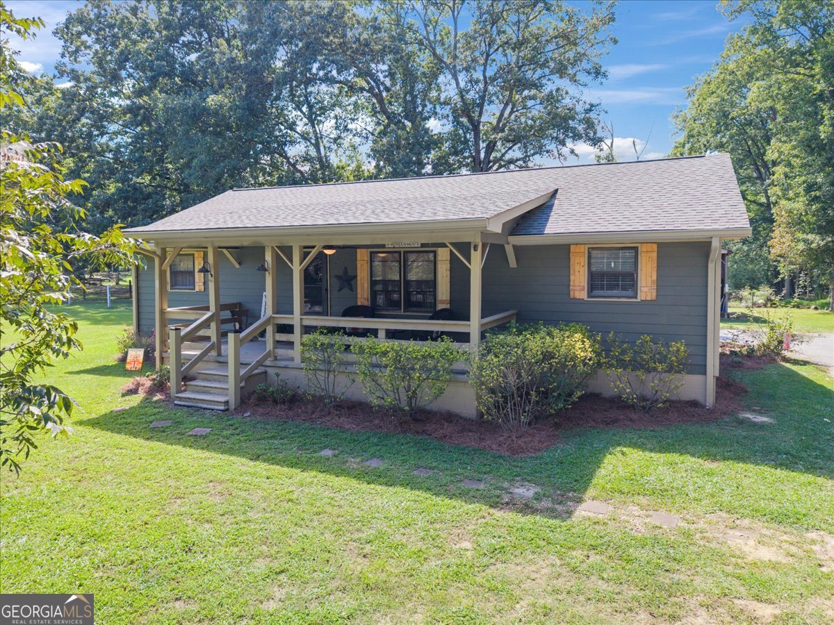 If you've been dreaming of country charm just minutes from downtown Monroe's shopping, dining, and amenities, this sweet cottage is the one! Tucked away on a private lot with peaceful pond views, it's the perfect place to relax and unwind. Inside, you'll find an easy-flow, split floor plan with laminate flooring throughout and a bright kitchen featuring granite countertops and stainless appliances. The covered back porch is the perfect spot to sip coffee in the mornings or unwind at the end of the day. Out back, a large barn adds plenty of space for storage, hobbies, or projects-giving you room to spread out without sacrificing the convenience of being close to town. With its combination of charm, practicality, and natural beauty, this property is a rare find!