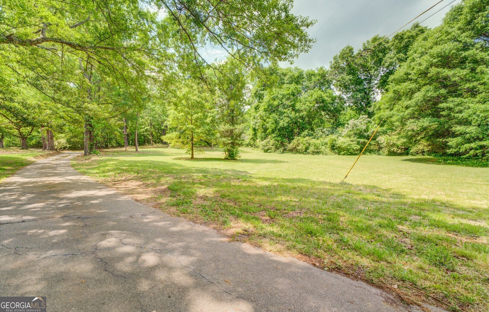 Location, location, location! Zoned commercial highway located on Highway 162 this 11.58+/- acres includes 201 feet of road frontage and is centrally located close to Covington, Porterdale, Conyers and McDonough. Power and water available just need to be hooked up. There is also a well on the property. Please call to schedule an appointment.