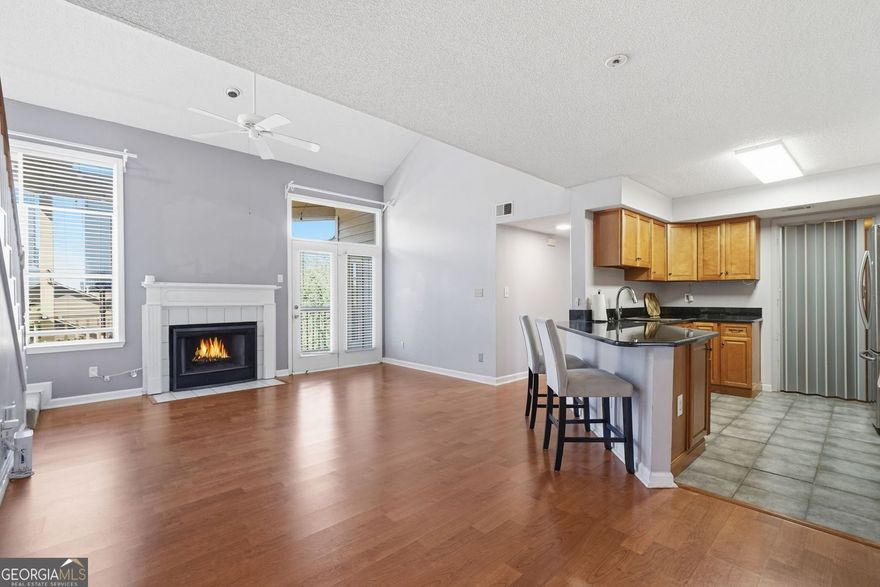 Updated 2BD/2BA Condo with Skyline Views in Gated McGill Park!  Just 1 mile to Inman Park Belt Line & under 2 miles to Piedmont Park, this beautiful condo offers one of the best views in the community-enjoy stunning downtown Atlanta skyline from your windows & private balcony. Open floor plan with seamless flow from the kitchen to living & dining areas, featuring a cozy fireplace for chilly nights. A spacious loft adds versatility-perfect as a guest suite, office, playroom, creative studio, or media room.  Recent updates include:  New flooring in living room, kitchen & owner's suite  Brand new HVAC system  New dishwasher  Enjoy summers at the community pool, added security in this gated neighborhood, and unbeatable access to I-75/85, shops, dining & parks. Unit is rental-eligible (on the rental list), making it a great option for investors or future flexibility. Seller open to buyer concessions with strong offer-don't miss this move-in ready gem!