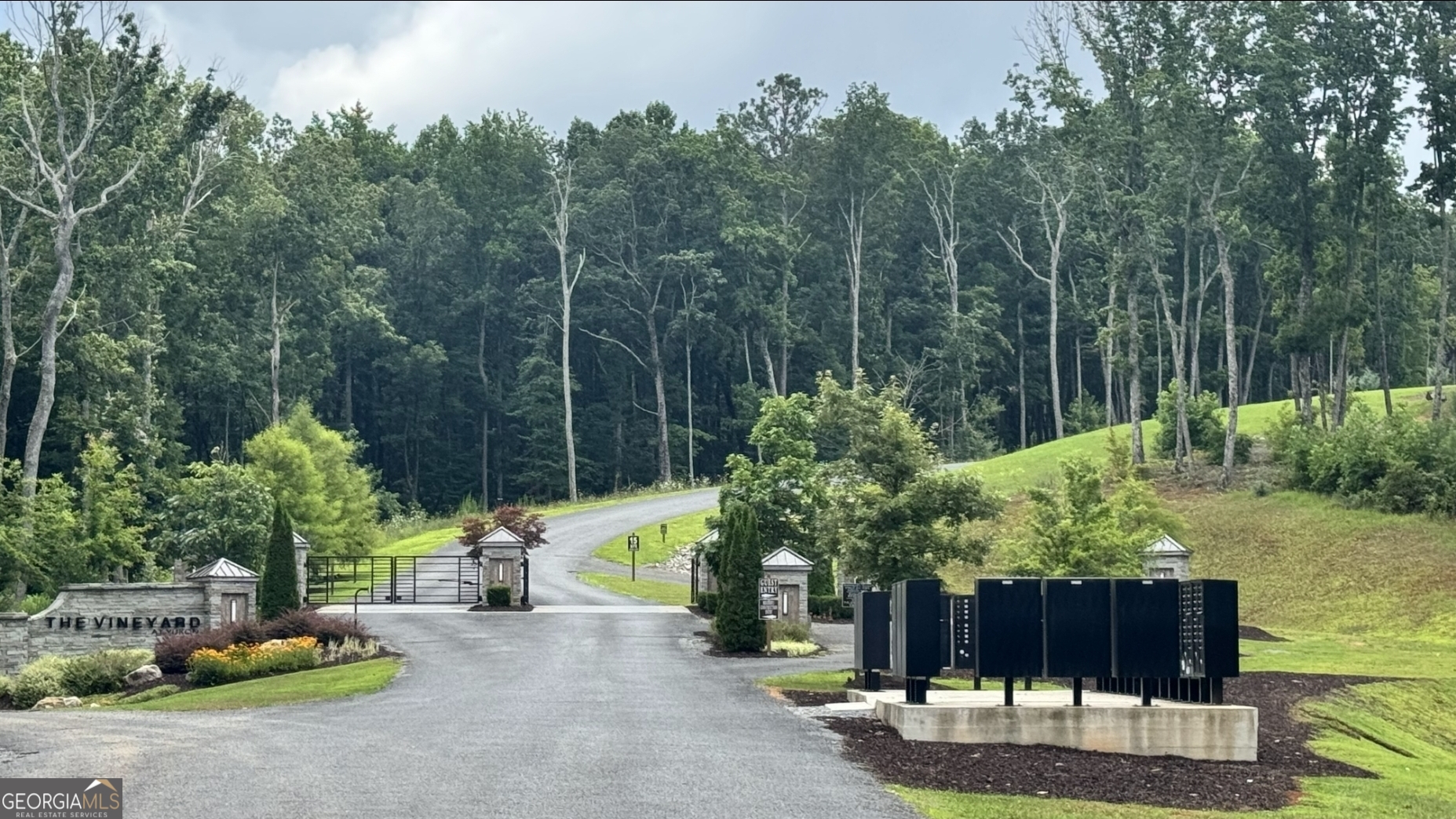 Build Your Dream Home at The Vineyard at Yukon - 2.23 Acres with Panoramic Mountain Views It's been on your mind-building your dream home on an exceptional property in one of the most breathtaking regions of Georgia. Welcome to The Vineyard at Yukon, where privacy, serenity, and stunning natural beauty come together. Set on 2.23 acres of level, ready-to-build land, this homesite offers year-round, panoramic mountain views-the perfect canvas for your custom retreat. Whether you're looking to build a primary residence or a mountain getaway, this property is your opportunity to embrace elevated living. Enjoy resort-style amenities including a mountain top pavilion and pool, designed for relaxation and community. When it's time to explore, you're just minutes from the charming towns of Blue Ridge, Ellijay, and Jasper-each offering quaint downtowns, farm-to-table dining, orchards, vineyards, and endless small-town charm. Why wait any longer? Your dream home begins with the right homesite-and this one is calling.