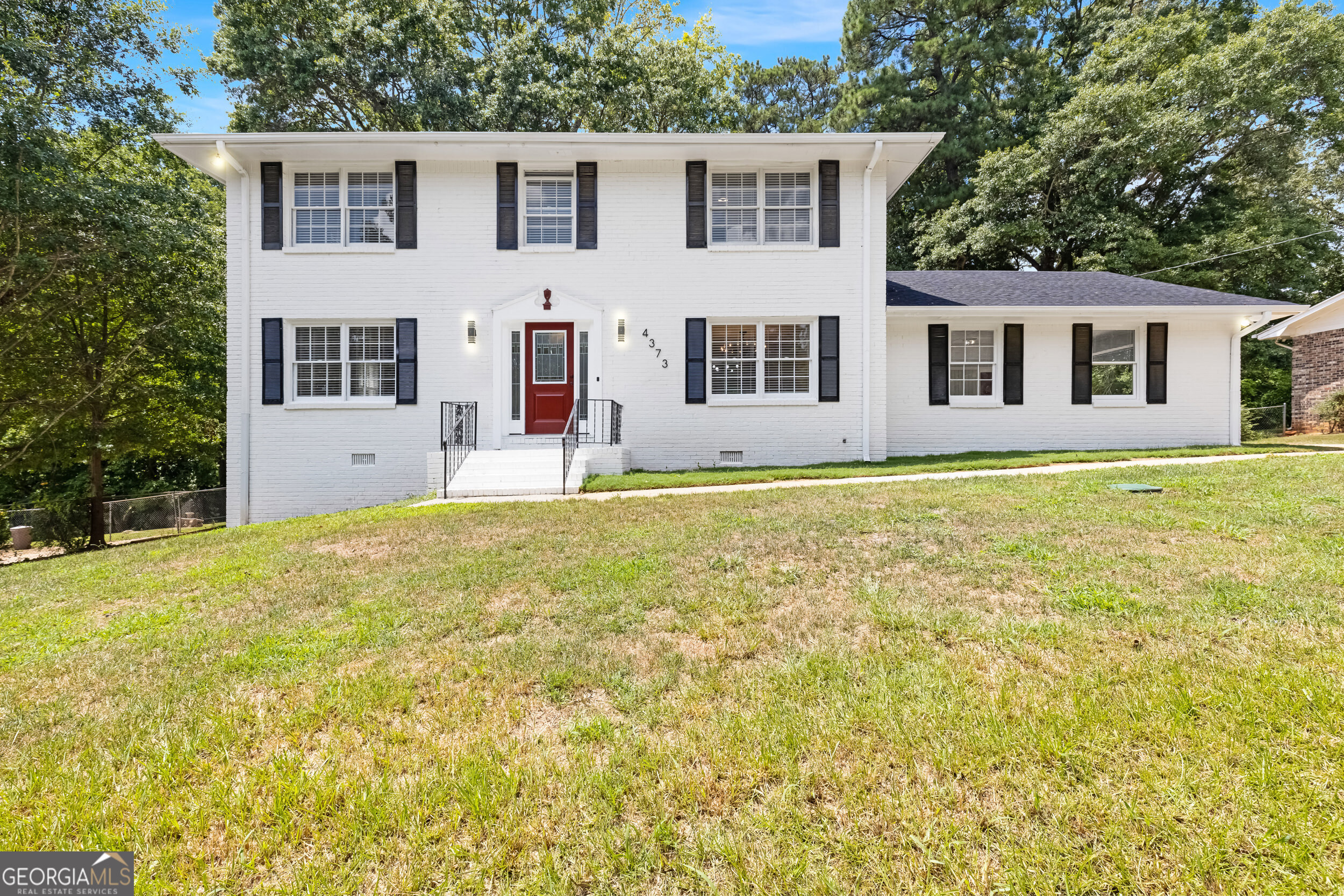 Beautifully Renovated Brick Home in Decatur This thoughtfully renovated two-story all-brick home in Decatur is bursting with charm and modern updates. Featuring four spacious bedrooms and two beautifully tiled bathrooms upstairs, the home showcases meticulous attention to detail throughout. Enjoy a large, level backyard filled with mature trees and vibrant flower beds-perfect for gardening enthusiasts. Just off the kitchen, a generous back deck offers the ideal space for outdoor dining and entertaining. Additional highlights include a two-car carport with extra storage space and a large basement with both interior and exterior entrances-perfectly suited for a teen suite, in-law apartment, or future rental potential. Don't miss this move-in ready gem in a prime Decatur location!.