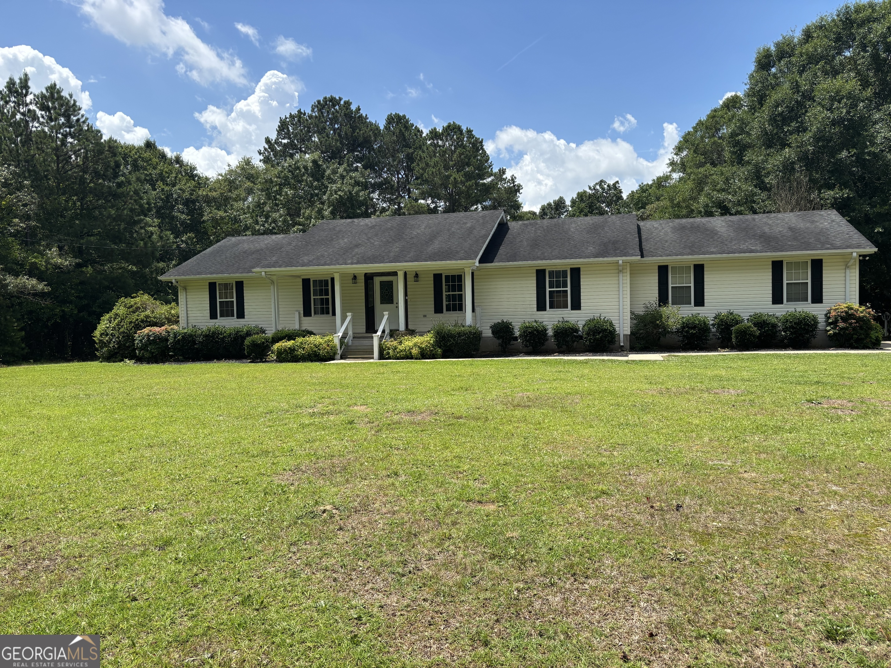 Welcome to this charming 3-bedroom, 2-bath home, perfectly tucked away on 2 level acres of serene and beauty. This home offers peace privacy, and proximity-just 5 to 7 mins from dining, golf and local attractions. Surrounded by a semi-wooded landscape, it's the perfect retreat for those who crave quite living without sacrificing convenience. This inviting property offers space to breathe, room to grow and a lifestyle that feels like a getaway. Ready to explore your own hidden haven? Let's schedule a tour!