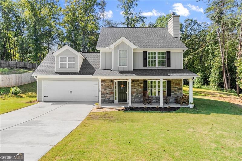 Spacious 4 bedroom, 2.5 bathroom home situated on a private 2.14-acre lot with a creek in Gainesville. This well-maintained property features a large family room with a cozy fireplace, a kitchen with custom cabinetry, granite countertops, and ceramic tile backsplash, and a generous master suite with tray ceilings, a large bath, and walk-in closet. Additional bedrooms provide flexible space for family, guests, or an office. Enjoy the privacy of a wooded lot while being conveniently located just minutes from Cool Springs Park, Murrayville Park, Publix and shopping, Highway 400, and the new hospital. A rare opportunity to own a home with acreage, charm, and convenience-all in one. Don't miss this one!