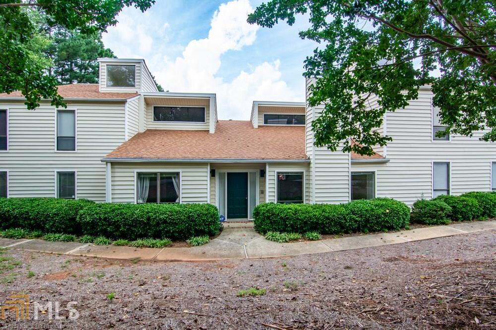 One Level! Condo located in the Best of Cobb County Schools. This spacious Condo offers Three bedrooms and Two baths. Secondary bedrooms walk out to a Private Enclosed Patio. Combination Living Room/Dining Room offers a Loft Area, High Ceilings, Fireplace and lots of Natural Light. Owner's Suite provides a large Walk-in Closet and Ensuite Bath. A Two Car Carport is attached and there is plenty of Guest Parking close by. Water heater replaced in June 2020. Walking Distance to Shopping, Grocery Shopping and Restaurants. Amenities include Two Pools, Clubhouse and Tennis Courts. Seller to give credit to buyer of $3,000 towards flooring.