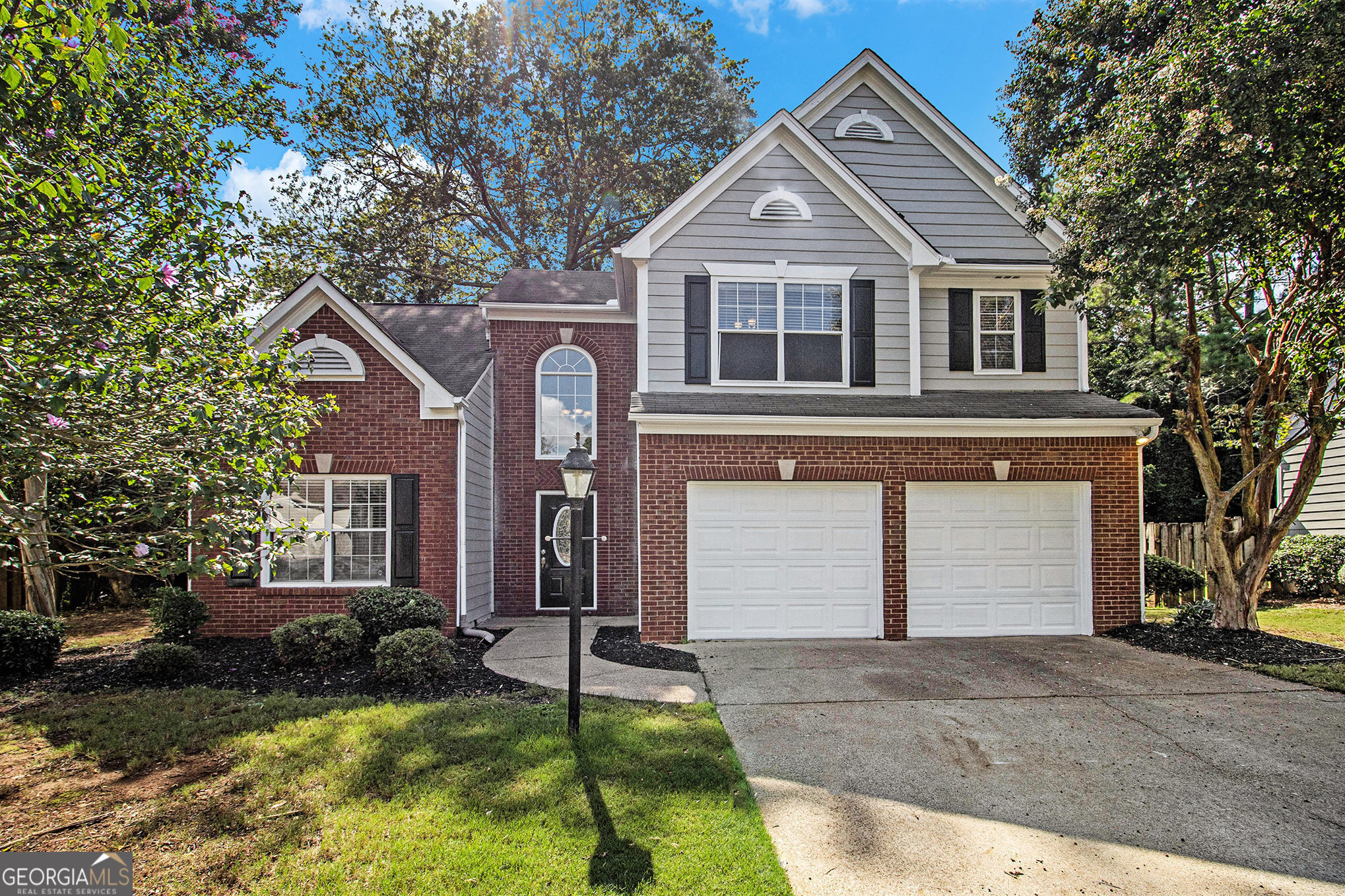 Enjoy outdoor entertaining on the expansive deck overlooking a private, wooded backyard-perfect for relaxing or hosting guests! Nestled on a beautifully manicured, level cul-de-sac lot, this home is located in a vibrant swim/tennis community in a sought-after East Cobb location. Inside, you'll find a bright and open floor plan featuring vaulted ceilings, gleaming hardwood floors, a central vacuum system, and both a separate living room and fireside family room. The eat-in kitchen shines with crisp white cabinetry and granite countertops, flowing seamlessly into the cozy family room. Upstairs, the spacious primary suite offers a tray ceiling, walk-in closet, and a spa-like en-suite bath with dual vanities, a garden tub, and a separate shower. Two additional bedrooms and a full bath complete the upper level. This move-in ready gem offers comfort, style, and a prime location-don't miss your chance to make it yours!