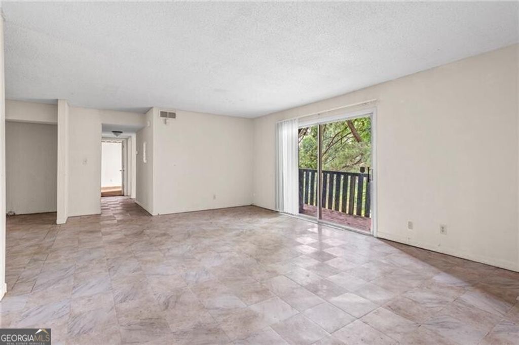 Photo of 1315 Camelot Drive, Atlanta, GA 30349 (MLS # 10670595)