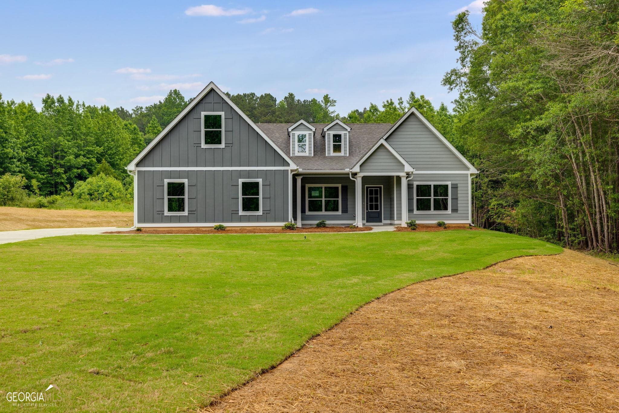 Looking for a GREAT HOME with some LAND? Look no further than PAYNE'S LAKE ROAD in Carroll County. Lot 6 features the CLAYMORE plan - with 4 bedrooms, 3 full bathrooms, OWNER'S SUITE on MAIN LEVEL along with 2 more bedrooms & full bath on MAIN LEVEL, Family Room & Den/Keeping Room with Fireplace, Super Open Kitchen with loads of cabinets & central island. There's also a gorgeous Dining Room, Upstairs has the 4th bedroom with 3rd Full Bathroom & TWO COVERED BACK PATIOS - one for sitting, one for grilling. Builder offers an EXCELLENT WARRANTY - homeowner orientation, ENERGY EFFICIENCY (spray foam insulation & LowE windows, etc) and DESIGNER FINISHES throughout. Don't let this one get away.