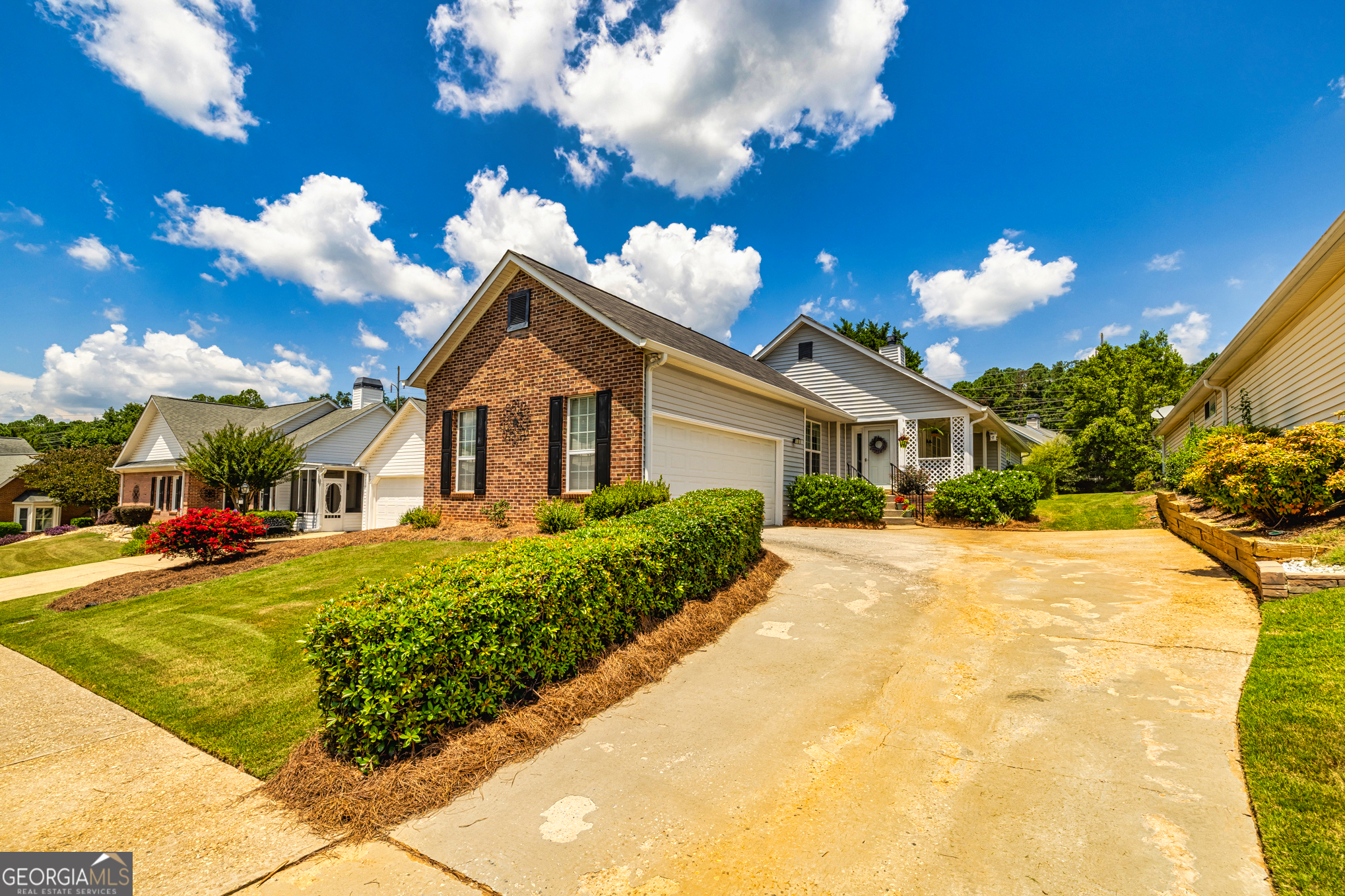 Welcome to Wonderful Woodgate - A Hidden Gem in the Heart of Fayetteville! Nestled in the sought-after Woodgate subdivision, this beautifully maintained home offers the perfect blend of comfort, style, and community living. From the moment you arrive, the charming courtyard entrance welcomes you in. Step inside to an open and airy floor plan designed for both everyday living and easy entertaining. The spacious family room features warm laminate flooring, built-in bookshelves, a cozy brick-surround fireplace, and a ceiling fan for year-round comfort. Just off the family room, step out onto the covered porch - the perfect spot to sip your morning coffee, listen to the birds, and take in the fresh air. Back inside, the dining room boasts elegant chair-rail and crown molding, creating a polished space for gatherings. The bright, updated kitchen, featuring stainless steel appliances, newer countertops, a breakfast bar, ceiling fan, pantry, and a sunny breakfast nook. Next is the Laundry Room with Shelving - Down the hallway, you'll find three generously sized bedrooms, including a peaceful primary suite with a walk-in closet, ceiling fan, and an open bathroom complete with dual vanities, a garden tub, a walk-in shower, and updated flooring. The hall bathroom offers tile flooring and a tub/shower combo for added convenience. Beyond the home, the Woodgate community offers a lifestyle you'll love - enjoy access to two swimming pools, a clubhouse, tennis courts, sidewalks, streetlights, and friendly neighbors. All of this just minutes from shopping, dining, parks, Trilith, and Fayetteville's vibrant downtown. Don't miss your opportunity to own this wonderful home in one of Fayetteville's lovely communities!