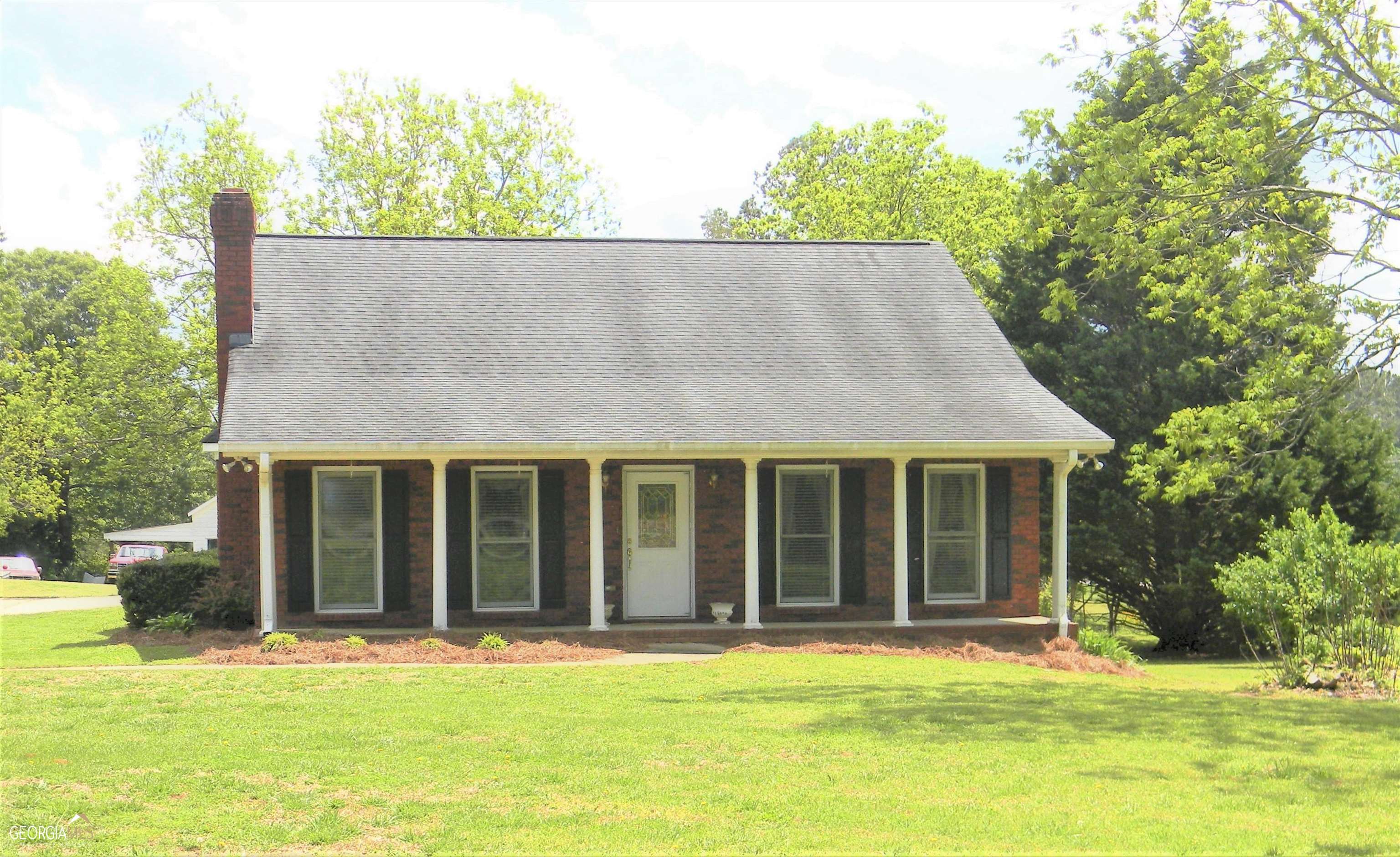 All brick ranch on .92 acre. Oversized kitchen with island and breakfast area. Separate Dining Room. Hardwood Flooring in Family Room, Dining Room, Kitchen and Laundry Room. 2 Large Bedrooms with walk in closets. Baths are tiled. Open carport. Country setting. Barn/Workshop at back of property. Entire property is cleared and grassed. Shown by appointment only. Property taxes reflect senior exemption. Home has been appraised.