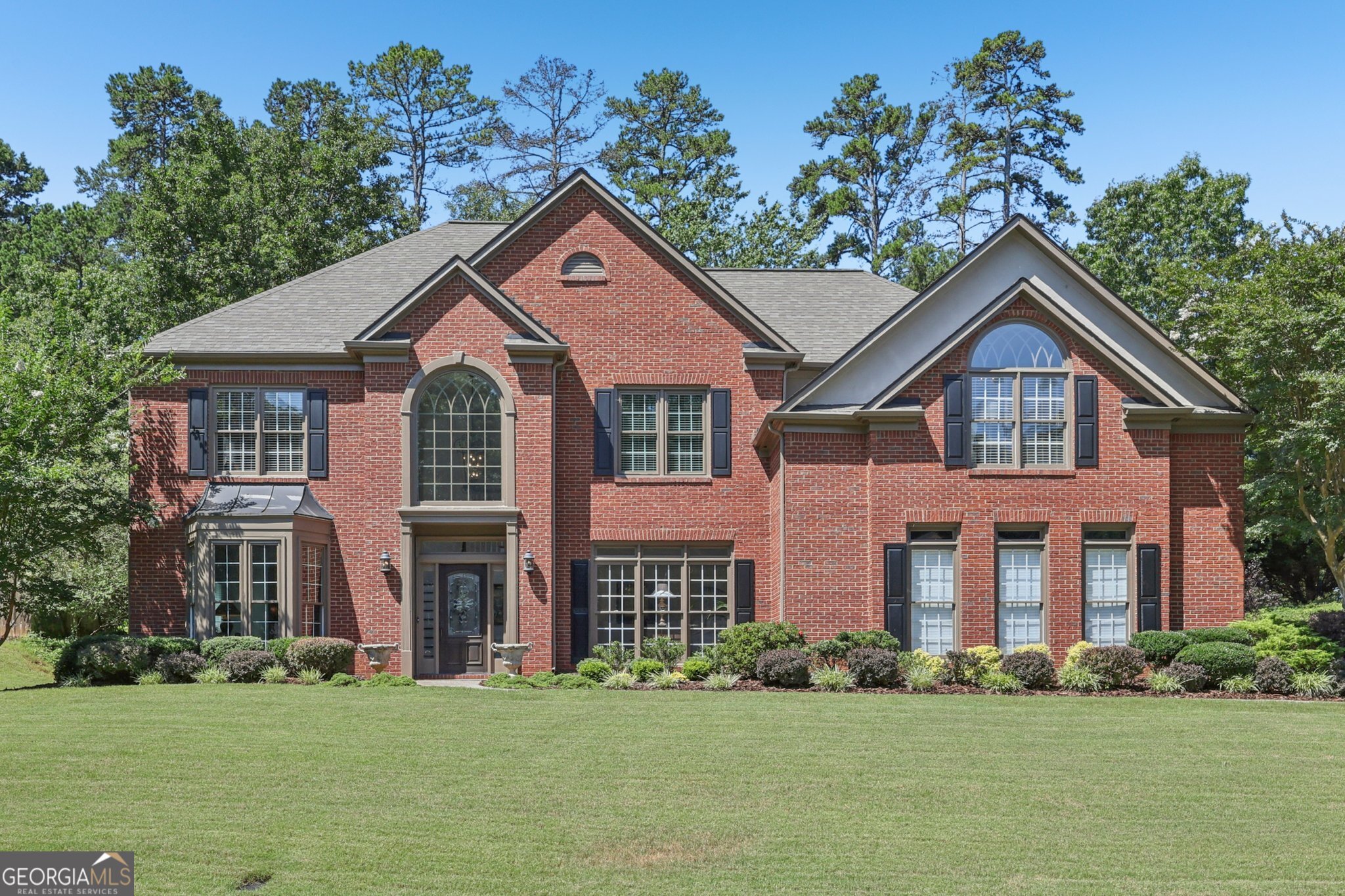 ELEGANT 3-SIDES BRICK HOME in the prestigious OLDEBRANCH section of the sought after MORNINGVIEW community with TOP-RATED NORTH GWINNETT SCHOOLS and UNMATCHED AMENITIES! This ORIGINAL OWNER home sits on one of the LARGEST FLOOR PLANS in the neighborhood, boasting over 4,100 square feet of beautifully updated living space, including a massive 3-car garage (800+ sq ft) with room for vehicles, storage, golf cart, or workshop! Close to $100K IN UPDATES AND UPGRADES over the past 6 years, including a new roof (2019), new floors, and a completely renovated kitchen. Nestled on a private lot, this residence features fresh white paint throughout the main level and newly installed engineered hardwood floors that flow seamlessly throughout the entire main and much of the upper level. The chef's kitchen showcases stunning high-end Calacatta Royale QUARTZ COUNTERTOPS, an oversized mahogany island, SOFT-CLOSE CABINETRY, and a FULLY UPDATED APPLIANCE PACKAGE, including double wall ovens, 5-burner gas downdraft cooktop, brand new refrigerator (2025), and beverage cooler. Upstairs, you'll find four oversized bedrooms, including an oversized owner's suite with a jacuzzi soaking tub, separate vanities, and a huge walk-in closet with his and her sides. A versatile loft area upstairs offers the perfect flex space for a home office or reading nook. Located in the highly desirable MorningView community, amenities include a clubhouse, three pools (including a splash pad and water slide), newly resurfaced tennis and pickleball courts, playground, and an active HOA. Enjoy 10+ miles of walking/biking nature trails, all accessed from the trailhead across the street from the clubhouse, just a half-mile walk from George Pierce Park, and a scenic 2.5-mile walk or bike ride to Suwanee Town Center, the library, Saturday farmers market, ice cream shops, coffee houses, and a variety of unique dining options. This home has been meticulously maintained and thoughtfully improved-perfect for the discerning buyer seeking luxury, lifestyle, and LOCATION! Showings are by APPOINTMENT ONLY beginning Friday (25th), and the OPEN HOUSE is on Saturday (26th) from 12-2.