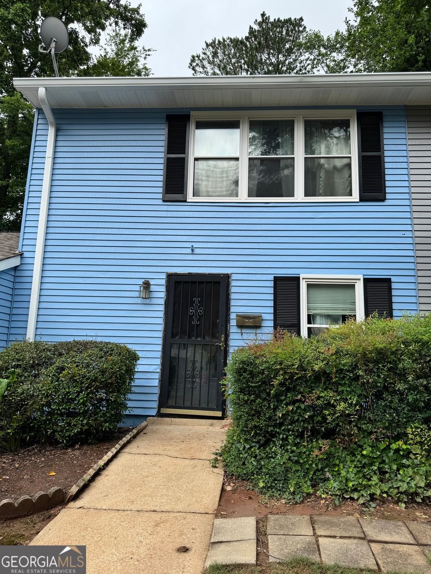 Great property in an even better location. The property features 2 bedrooms and 1.5 bath. The Battery Atlanta, Kennesaw Mountain, KSU, and Kennestone Hospital, and steps away from Tumlin Park's tennis courts, walking trails, and playground, this home is ideally positioned for both leisure and convenience. The $300 monthly HOA dues provide significant value, covering water, trash, sewer, community pool, and exterior maintenance, while also offering potential rental opportunity. Don't miss out on this exceptional opportunity for a chic, low-maintenance lifestyle in a prime location!