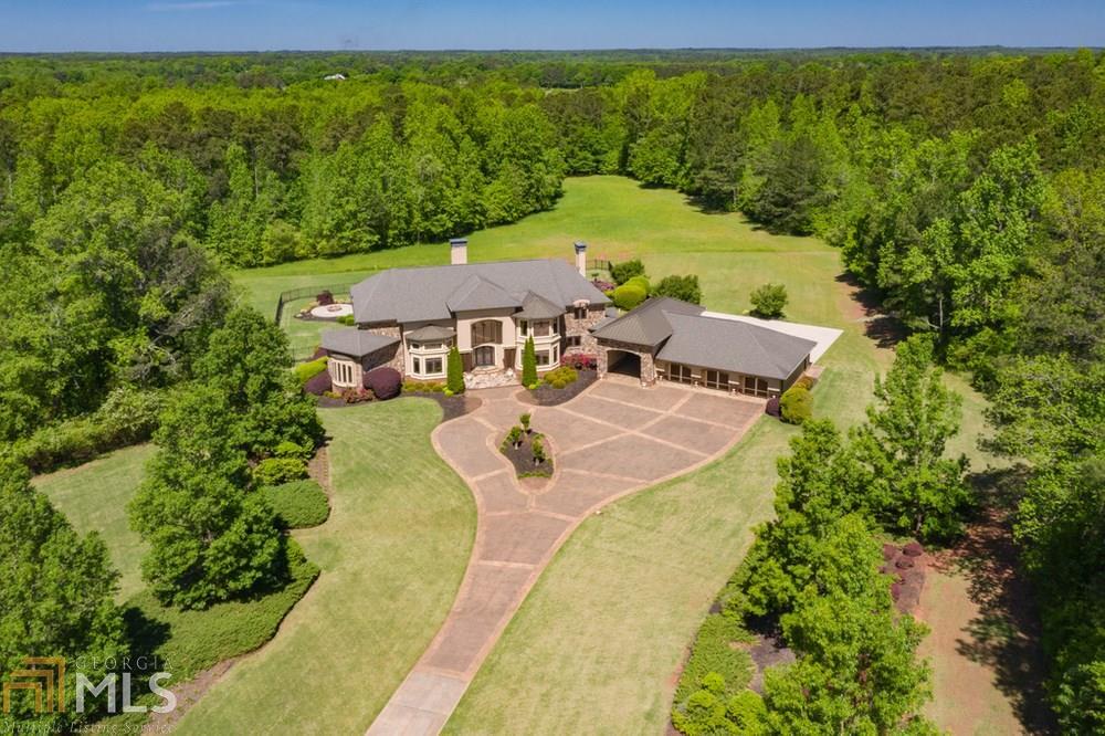 This gorgeous one-of-a-kind estate offers luxury living on a private, beautifully landscaped 58 acres!  Enter the property through a secure privacy gate and you will be in awe of the magnificent architecture.  Custom built in 2006 to meet extremely high specifications for efficiency and longevity.  The Tuscan inspired finishes will set this home apart from any other luxury property you have seen. Cozy up by one of the three lovely stone fireplaces, or gather in the chef's kitchen.