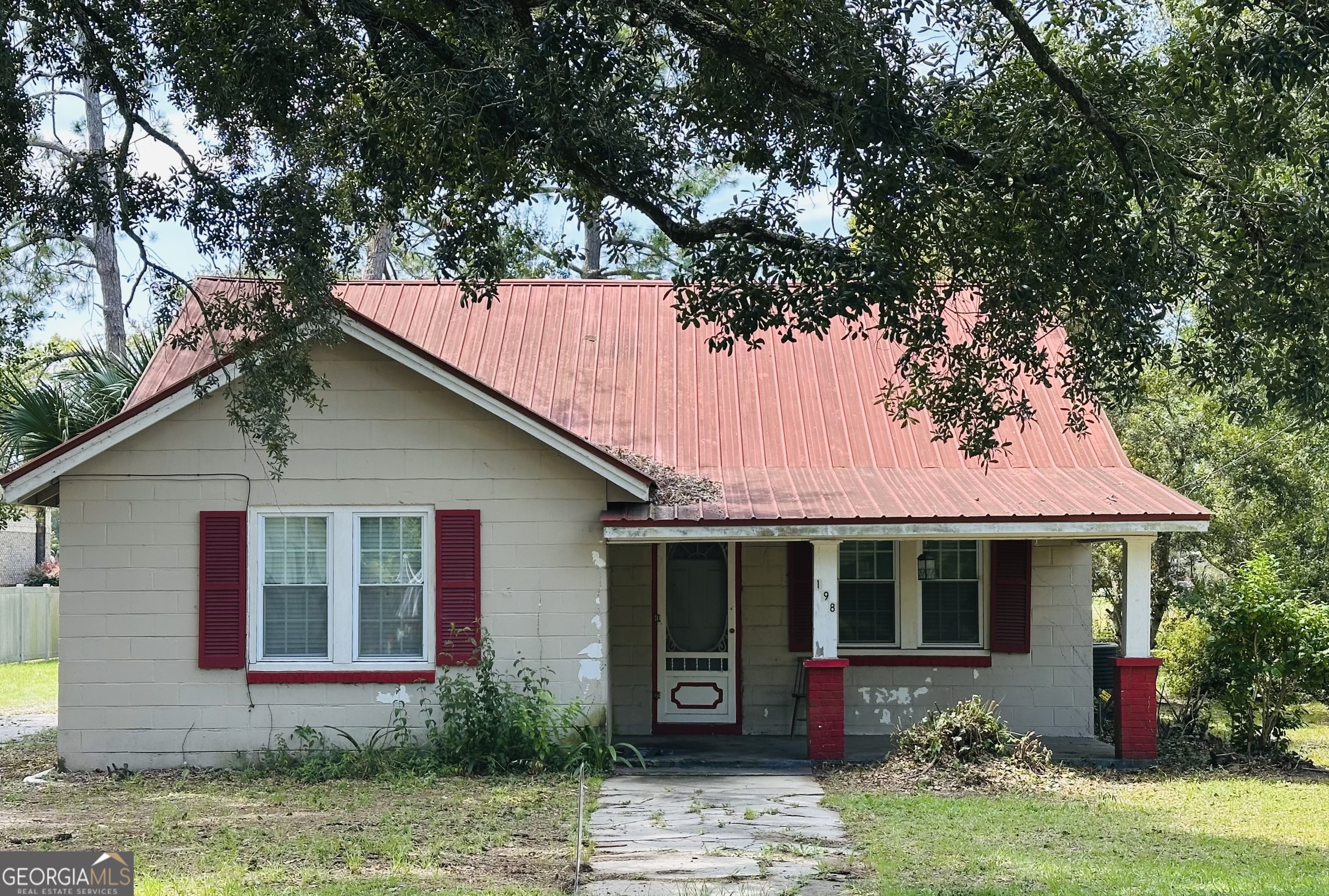 This 4 bedroom 2 Bath home is in City Limits and Convenient to everything! Schools, Parks, Hospital, Restaurants and Shopping! With 3 bedrooms and 1 bath downstairs and 1 bedroom 1 bath upstairs it has plenty of space for a growing family. Spacious backyard has a extra building with electric and plumbing run to it so it can be used for a shop, extra storage or with some work and TLC maybe a guest house. This home is a Block house with Metal Roof , sits on concrete foundation so very strong bones with loads of potential waiting for someone to come pour some love into it and make it their own! Schedule a showing today and lets get started on making it yours!