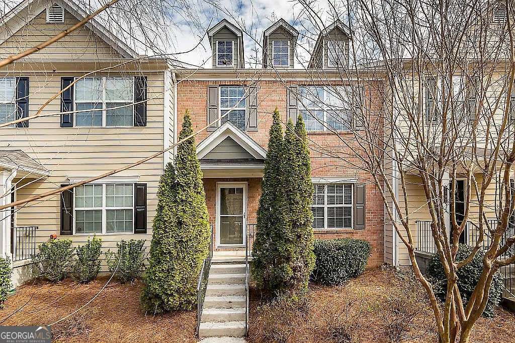 Coming Soon! Welcome home to this beautiful 3-bedroom, 3-bath townhome located just minutes from the Outlet Shoppes at Atlanta, Costco, and Woodstock City Church! Situated in a desirable swim/tennis community, this home offers comfort, convenience, and a great location. The main level features a bright living room and an eat-in kitchen with a small pantry and access to a private deck - perfect for relaxing or entertaining. Upstairs, the spacious primary suite includes a walk-in closet and private bathroom. Two additional bedrooms, a second full bath, and a laundry room located in the hallway provide ample space and functionality. Downstairs, you'll find a finished bonus room ideal for a home office, gym, or extra storage. The home also includes a two-car garage and additional parking in the private driveway.