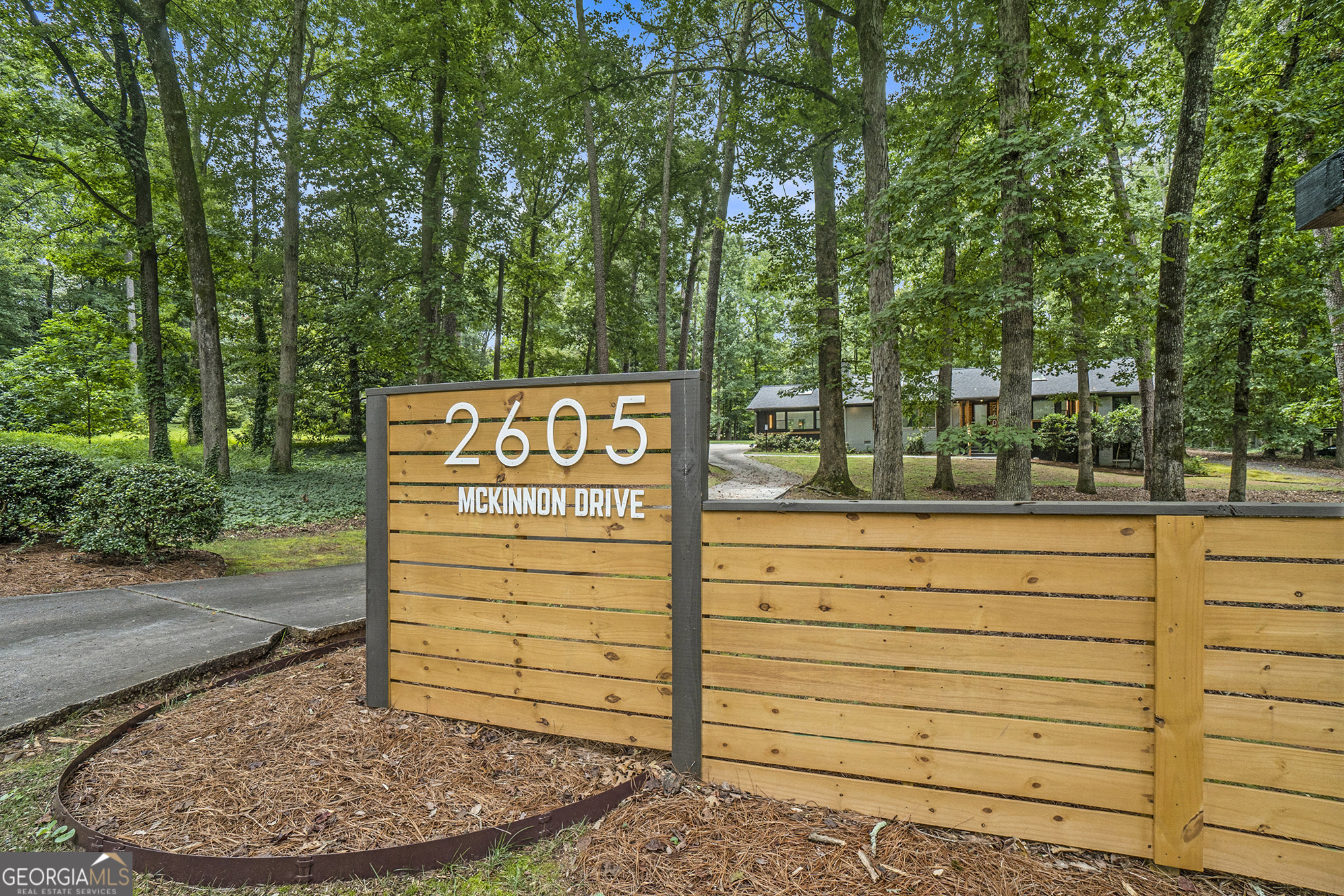 Set on a secluded 1.24-acre property, this masterfully re-imagined mid-century brick and cedar ranch is a rare opportunity to own a home on one of Decatur's most prized streets. The yard is framed by a canopy of mature hardwoods and lush landscaping, offering both privacy and an intimate connection to nature. A comprehensive renovation was completed in 2025, blending architectural integrity with thoughtful refinement. Inside, natural light is abundant thanks to strategically placed skylights and sun tunnels. Expansive picture windows and French doors invite the outdoors in, creating a serene, gallery-like atmosphere. A redesigned kitchen and laundry space along with smart home automation, commercial-grade Wi-Fi infrastructure, LED lighting, sophisticated fixtures, newly refinished hardwood floors, a new architectural shingled 2025 roof, and all new casement windows are just a few of the reasons you'll love this home. Almost no stone has been left unturned. Although listed as a 3 bedroom, the office can be easily re-converted to a 4th bedroom if desired. The unfinished downstairs area is perfect for additional storage, a game room/gym, or it can be finished out for more living space (has been pre-plumbed). The home is only 2 miles from Decatur square, where you can take a stroll to the many wonderful shops, restaurants, festivals, and live music. The 77-acre Legacy Park, connected to the Greenway, is less than a mile away w/ wetlands, athletic fields, & community gardens. The Museum Charter School is also very close. No city taxes. This is the one you've been waiting for!