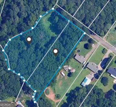 RARE undeveloped lot in residential neighborhood for sale on cul-de-sac. TWO parcels being sold together for a total of approx. 2.3 acres of valuable land in Lawrenceville. Highly desirable area, perfect for your dream home, just bring your builder. Located in a quiet neighborhood and at the end of a cul-de-sac, this property backs up to a creek and is surrounded by peaceful serenity, truly offering a once-in-a-lifetime opportunity to build your dream home in highly sought-after Lawrenceville. Located just a short drive from local restaurants, downtown Lawrenceville, Paper Mill Playhouse, shopping, Gwinnett County airport, and easy access to local highways, you couldn't ask for a better location. This residential zoned lot is ready for you to bring your vision to life. Grab this opportunity as it will not last long!