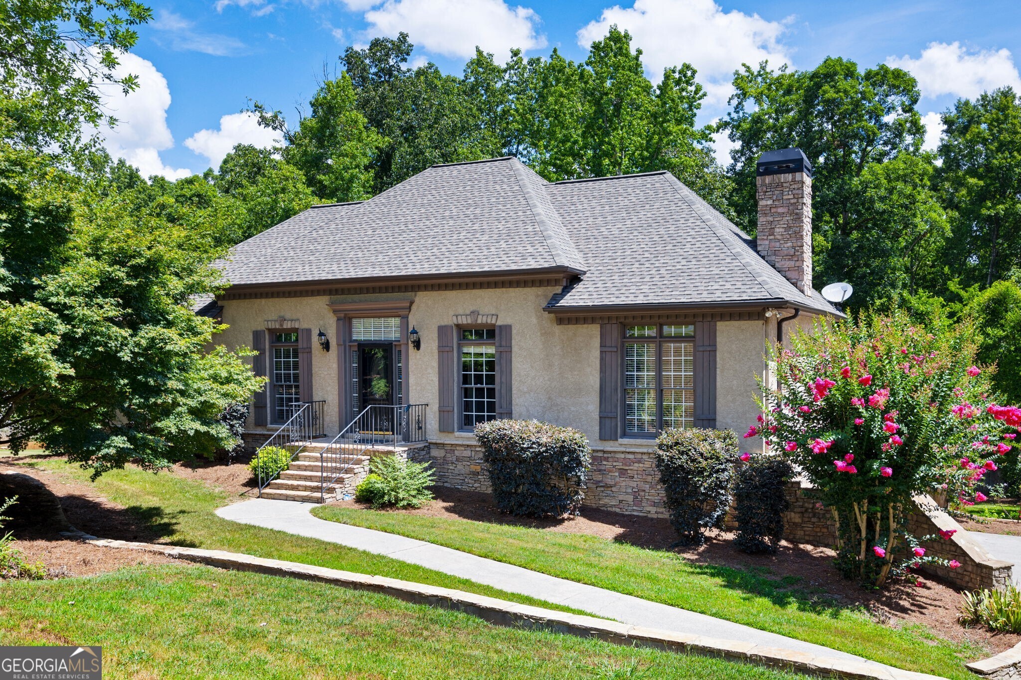 This charming home offers a perfect blend of comfort, style and functionality. With a thoughtfully designed layout this residence meets the needs of today's family while providing cozy spaces for relaxation and entertainment. Experience the convenience of having your primary suite on the main floor. This suite boasts a warm fireplace making it the perfect spot to unwind at the end of the day. The main level further offers 2 additional bedrooms, perfect for family or guests along with 2 full bathrooms. There is also a Functional flex room whether you need a home office or a cozy reading nook. This versatile flex room allows for endless possibilities. The heart of the home is the inviting family room featuring a brick fireplace that serves as a focal point for gatherings. This open concept space flows effortlessly into the eat in kitchen as well as the separate dining room creating a seamless environment for entertaining family and friends. The partially finished basement expands your living space with a large family/game room perfect for movie nights or game days. You will also appreciate another bedroom and full bath perfect for your teenager or overnight guests. Step outside to your outdoor oasis. The expansive deck invites you to bask in the sun or host summer barbeques. The patio area features an enchanting fireplace perfect for an evening under the stars. And don't forget the serene koi pond adding a touch of tranquility to your outdoor experience. So, whether your sipping coffee on the deck or hosting gatherings around the fire this home is designed for living life to the fullest.