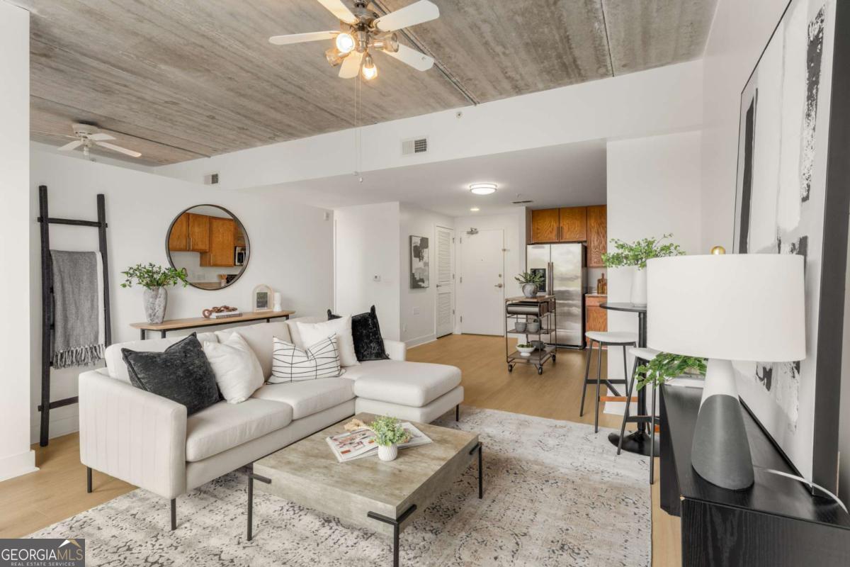 *MAJOR PRICE IMPROVEMENT* Live in the heart of the Beltline neighborhoods in style and comfort! Discover the perfect blend of urban living and modern comfort in this beautiful 1 bed / 1 bath condo, ideally located by in the vibrant Oakland Park building. This light-filled home boasts a bright, open floor plan with soaring 10-foot ceilings and dramatic floor-to-ceiling windows that showcase stunning views. Freshly painted with new flooring throughout, the layout flows seamlessly into a spacious kitchen-ideal for entertaining or everyday living. Whether you're working from home or commuting to the office, this versatile space adapts to your lifestyle. Step out onto your private balcony for a peaceful morning coffee or head to the community rooftop deck, where you'll find grills, lounge areas, and sweeping Atlanta skyline views-perfect for gathering with friends. Oakland Park is a LEED-certified community, offering modern efficiency & lower utility costs - as well as access to the full fitness center, just down the hall from your condo. Park your car for the weekend in the gated & secure, covered garage and explore everything the area has to offer-walk to local events, markets, and green spaces in Grant Park, Cabbagetown, Reynoldstown, along the Beltline, and Historic Oakland Cemetery. You're just steps from award-winning restaurants, pubs, coffee shops, and everyday retail conveniences! Bikes lanes added to Memorial have greatly improved traffic & noise in this area, while enhancing accessibility. Proximity to major roads & the interstate make traveling throughout the city & metro a breeze. Oakland Park features terrific amenities, an amazing welcoming community of residents, and an unbeatable location - plus a LOW HOA fee! Leasing permits are available now for those interested in a rental and Conventional/FHA/VA loans are all welcome. Come experience the best of in-town Atlanta living!