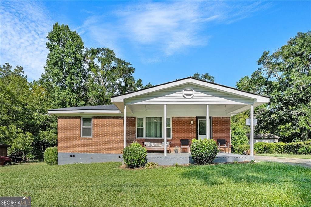 PRICE IMPROVEMENT for this charming 3 bedroom, 1 bath, ONE LEVEL HOME with NO HOA. This 4-sided brick home with a front and large back yard is perfectly located less than 2 miles from the interstate and just 13 miles to Hartsfield Atlanta Airport. Enjoy easy access to dining, shopping, parks, public transportation, local government offices, event spaces, and entertainment. Ideal as your primary home or a smart investment property, this home offers convenience, comfort, and opportunity all in one. Schedule a tour before it is gone.