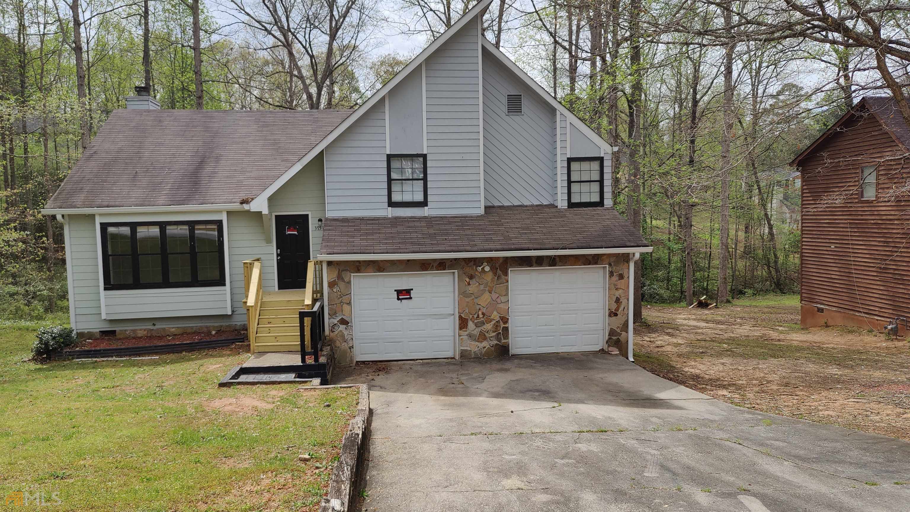 Welcome home to this well-maintained A/frame home in a well-established neighborhood. This home features a large living room with picture windows bringing in lots of natural light. Eat-in kitchen with white cabinets, laminate counters, and newer tile in kitchen. Large master bedroom with garden tub, and separate tiled bathroom. Spacious guest bedrooms and bathrooms with new tile and counters. Sunken family room with fireplace, updated bathroom, and bedroom (or home office). The deck overlooks a level backyard with nice hardwoods and a creek in the back. The neighborhood is close to parks, shopping, eateries, and freeways for access to the Airport and Atlanta. Come make this home yours today.