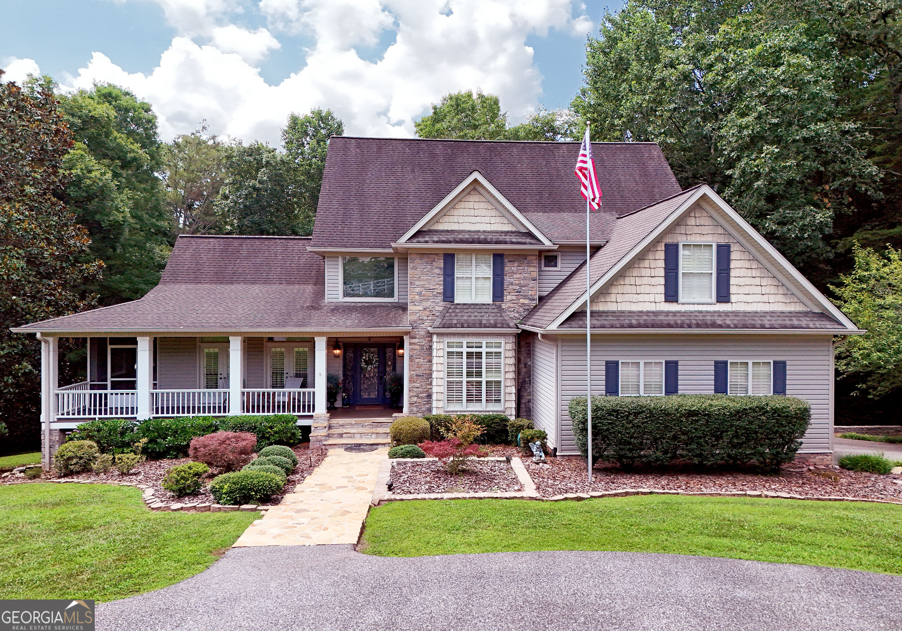 Enjoy living in your Custom Built Home on 1.54 Acres in highly desirable impeccably kept Coosa Walk Subdivision only 3 minutes from downtown Blairsville. Total living area is 5773 sq/ft. Outstanding features of this amazing home starts with a custom Chef's Kitchen on the main floor. with Double Ovens by KItchen Aid, Thermador Cooktop along with built in drawers, Bosch dishwasher, ice machine, and disposal, Custom Cabinetry, Granet Countertops and indirect lighting , built in Island, Dine in area, dual chandeliers and custom flooring. step into the formal dining room including custom coffered ceilings, sconce lighting and custom chandelier. Double doors lead to your oversized private master bedroom that includes a custom master bath with dual vanities, floor to ceiling cabinetry . walk in closet, jaccuzi tub, large steam shower with rain shower and full body heads, heated marble tile flooring, and French doors opening to custom deck planked with Trex flooring. Main floor Living Room has built in floor to ceiling cabinetry, fireplace with floor to ceiling stack stone, and a chandelier accenting the beamed vaulted ceiling, built in surround sound system and 4 pair of custom French Doors that open to wrap around porch. all windows and door have plantation shutters and crown molding. Upstairs you will find 4 bedrooms and 2 full bathrooms, a loft, stained glass window and lot of storage. Now to the basement, fully finished 2080 sq/ft of space. Solid mahogany wood walls and doors accent this incredible environment hosts a movie theater, built in gun case/bookshelves, a full designer kitchen complete with oven, cooktop, fridge, wine cooler, bar, granite counter, Two floor to ceiling stack stone fireplaces, pool table, surround sound system, full bathroom and Heated Travertine floors all opening to large under deck with brick paver flooring. Outside enjoy the manicured 1.54 acre lawn with planters , garden area and mature landscaping, small pond next to creek.
