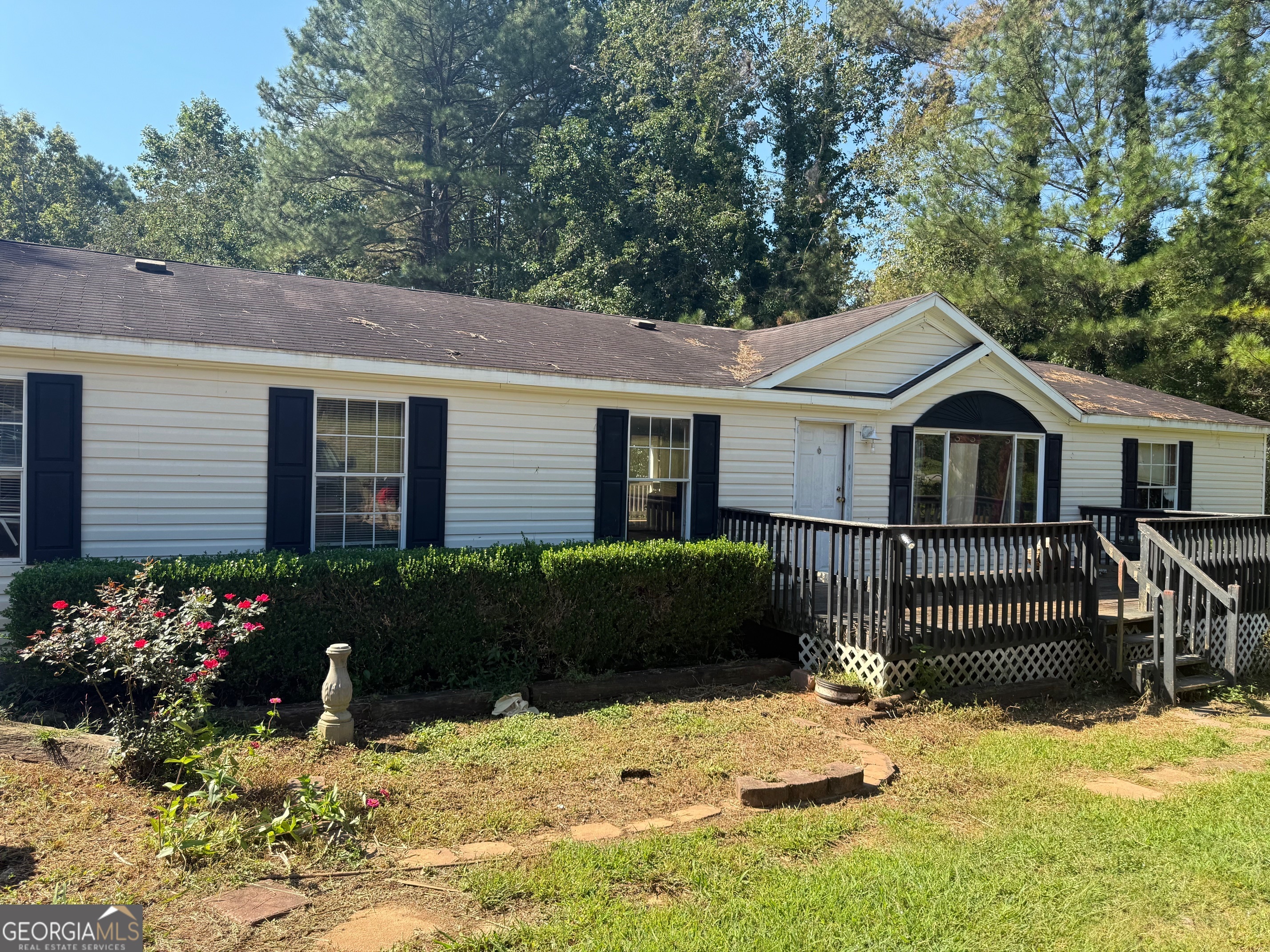 Investor Special. Fixer-Upper near Lake Lanier. 3-bedroom, 2-bath mobile home on a large lot in a desirable location. Close to Lake Lanier and convenient to shopping and dining. Sold as-is. Bring your imagination and make this home your own.