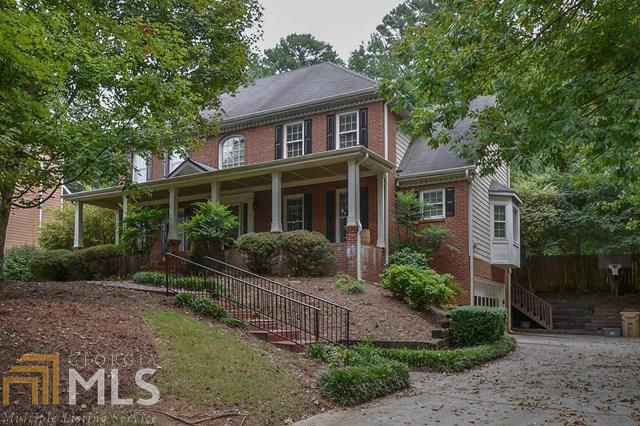 Wonderful Suwanee neighborhood offers large lots with mature landscaping and S/T amenities. This two story traditional has a front porch you can actually use. Large, country kitchen with breakfast bar, hardwoods and stained cabinets. Built-ins surround fireplace in family room. Formal living and dining rooms. Four generously sized bedrooms upstairs. Sought after N.Gwinnett school cluster. Great location, close to everything.restaurants, shopping, Suwanee Town Center, Mall of Georgia and Lake Lanier. All that Suwanee has to offer is right at your fingertips!