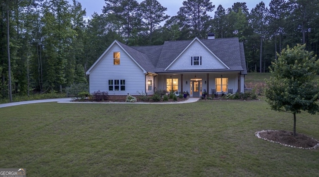 Come claim your little slice of heaven just outside the city limits of Monroe on beautiful Dean Hill Road! No HOA! Gorgeous estate homes on large lots line this area that's conveniently located in the popular Walnut Grove school district. This particular lot offers privacy galore! The home sits atop the sloped lot that levels off in the back to accommodate the board-fenced, heated in-ground, salt water gunite pool and lush garden area with precious potting station! Over 25 varieties of vegetables and plants, including cilantro, strawberries, blueberries, parsley & mint, a lemon tree, persimmon tree, rose bushes, magnolias..the list goes on- a true gardeners paradise!!! And don't miss the storage shed for lawn equipment & chicken coop on edge of property line so you can gather organic eggs daily! Inside you will find an open-concept floor plan with split-bedroom layout. Large kitchen with professional grade GE Profile stainless steel appliances and gas range, large island with bar seating, and breakfast area overlooking the pool. Separate dining room can seat 12. Mud room with hooks and bench for all the kids backpacks and sports equipment as well as utility sink and shelving for appliances. On one side of the home, you will find 3 full bedrooms: one with its own private bath and two that share a jack and jill bath. On the opposite side is the oversized owner's suite that leads to the pool deck. Master bath has walk-in shower, double vanity, and large soaking tub, as well as large walk-in closet. Use the upstairs bonus room as a 5th bedroom, office, playroom, or home gym! The outdoor area completes this home with a professionally lit pool area with pergola, fire pit area, and hot tub, as well as area for play set! Let the kids swim while you keep an eye on them from your kitchen windows! You'll love calling Dean Hill Rd home!