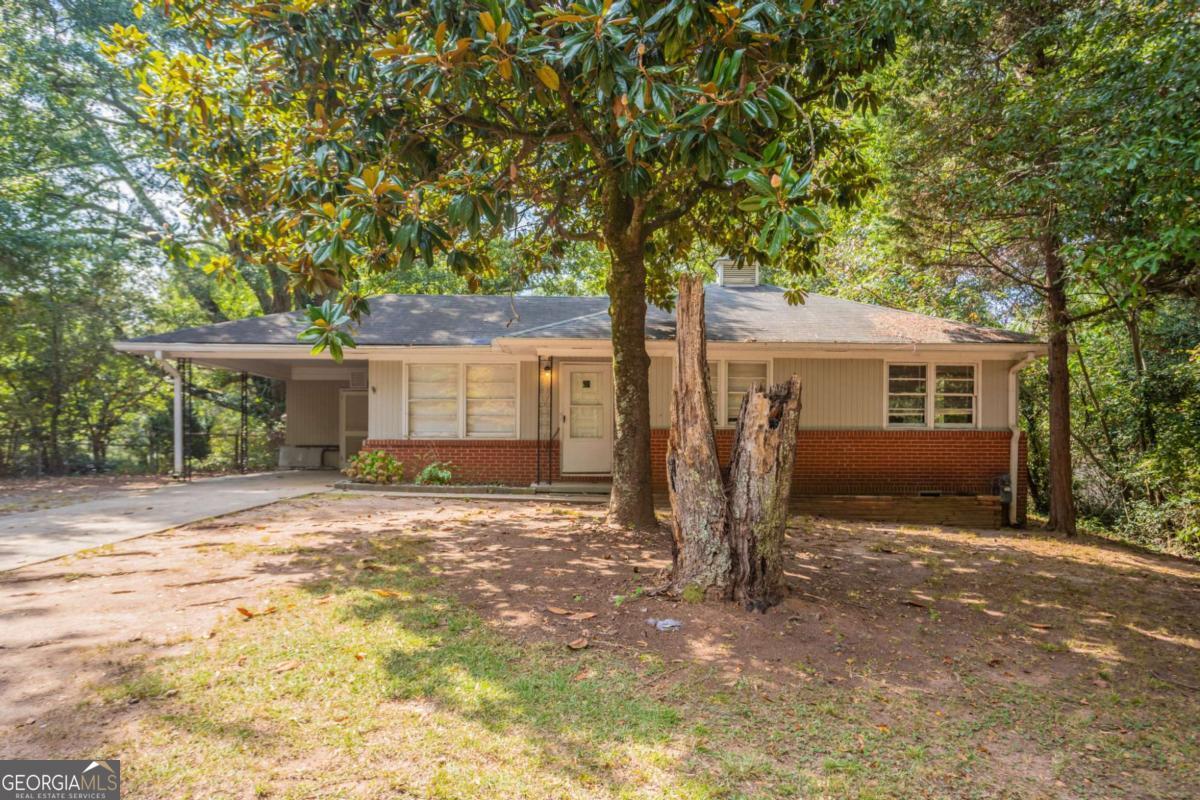 Opportunity awaits with this Marietta home, ideally located in a quiet residential neighborhood with convenient access to all that Cobb County has to offer. This property is in need of a full renovation and is perfect for investors, flippers, or buyers looking to customize their dream home from the ground up. The existing layout offers a functional foundation with a spacious living area, connected kitchen and dining spaces, and generously sized bedrooms. Outside, the private yard holds great potential for creating an outdoor retreat. With solid bones and a prime location, this is a blank canvas ready for transformation.