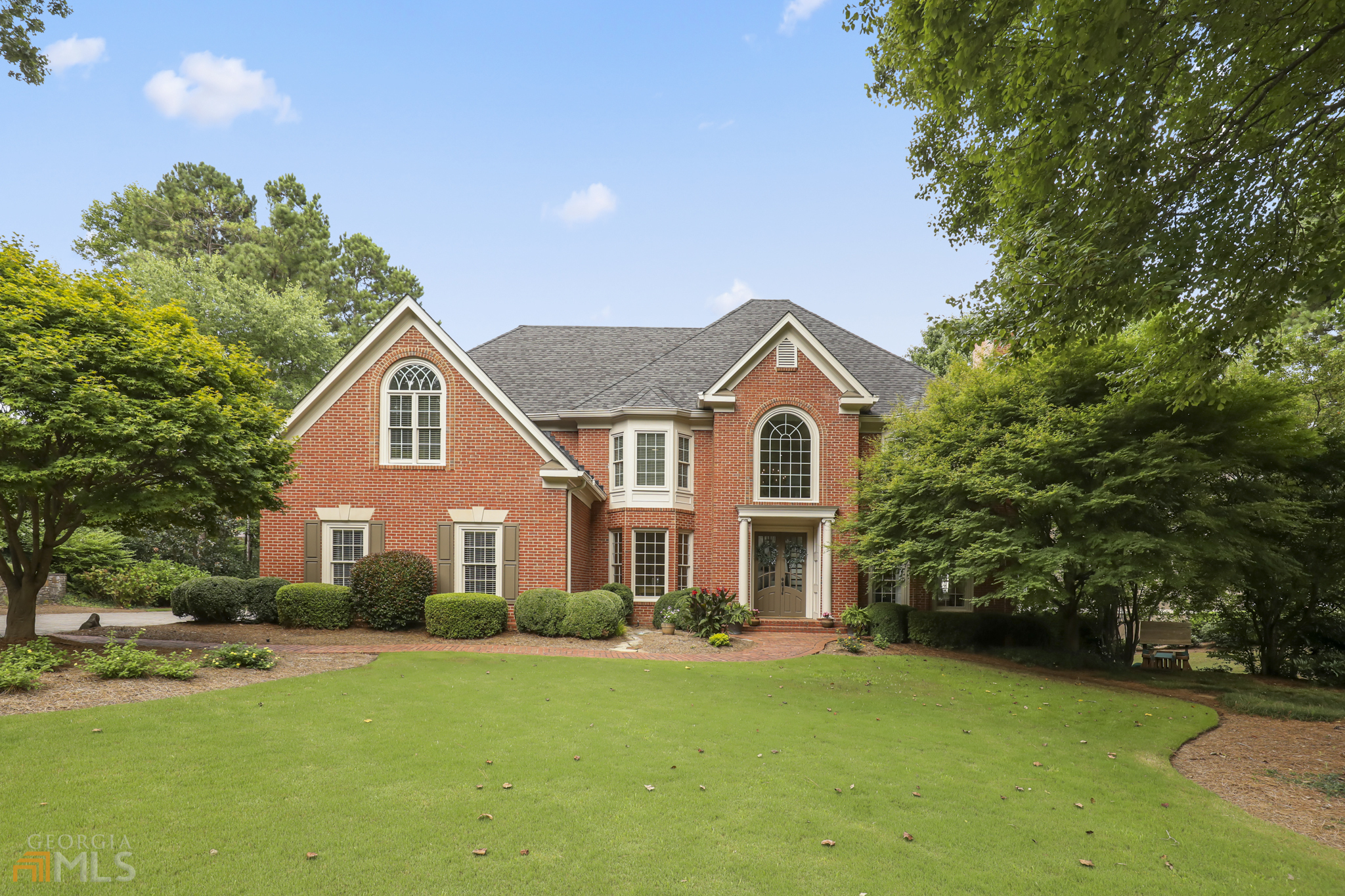 AMAZING!! Saltwater Gunite Pool with Spillover Spa...on absolutely GORGEOUS LOT on a peaceful pond! The Backyard Paradise also features a Pergola, a Large Rear Deck with Covered Patio Below! Finished Terrace Level & 3-Car Side Entry Garage. Freshly painted inside and out. UPDATED Secondary Baths! Double Doors & Covered Entry. 2-Story Foyer with Curved Staircase & Double Trey Ceiling. Gentleman's Study. Formal LR w/FP. Banquet Sized DR Overlooks Pool and Gardens. Gourmet Kit features Exotic Marble Counters & Island, White Custom Cabinets, Farmer's Sink, Pot Filler. Premium Appliances include S/S Viking Cooktop, Viking Double Ovens w/ Warming Drawer, Built-in KitchenAid Fridge, and Asko Dishwasher. The Breakfast Bar seats 6 under Rustic Pendant Lighting. Bright Breakfast Area. Walk-In Butler's Pantry and a Home Management Area. A 2-Story Family Room Boasts a Striking Chandelier, Palladian Windows, and a Raised Hearth Fireplace. Many windows are NEW. French Doors open to Deck. Rear Stairs lead up to Two BRs w/ Updated Jack & Jill Bath. The Large, Front BR offers Vaulted Ceiling, Palladian Window & Walk-In Closet. The 3rd BR features a Bayed Window & Updated Private Bath. The Master Suite offers Views of the Backyard, HW Floors, Trey Ceiling, & Bayed Sitting Area. The Master Bath features a Barrel Ceiling, Granite Vanities & Bayed Jetted Tub. The Huge Custom Master Closet opens to a Laundry Room. The Finished Terrace Level has lots of Storage, Trey Ceiling, Upgraded Carpet & Wood Flooring. The Rec Area offers an a Rustic Stone, Raised Hearth Fireplace. Also an Exercise Area and Arched Game Room Opening to the Patio & Pool Deck boasts a Casual Bar w/Granite, Microwave, Built-In Dishwasher & Refrigerator. Also a Convenient Changing Area & Full Bath. Absolutely Stunning! *All offers due no later than 3PM 8/13/22