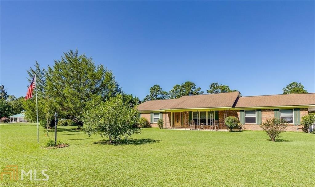 Brick home on 3 acres with separate efficiency apartment (currently rented.) Main home has 3 bedrooms and 2 full baths, large kitchen and open dining, with large family room with gas fireplace. There is also a playroom for the kids with built in seating and storage. Home has large new in-ground swimming pool, huge covered patio and large carport. Property also has a stocked pond with a pond house with a deck over the pond. The efficiency apartment is on the pond, with the back porch over looking the water. This is a perfect place to raise your family!