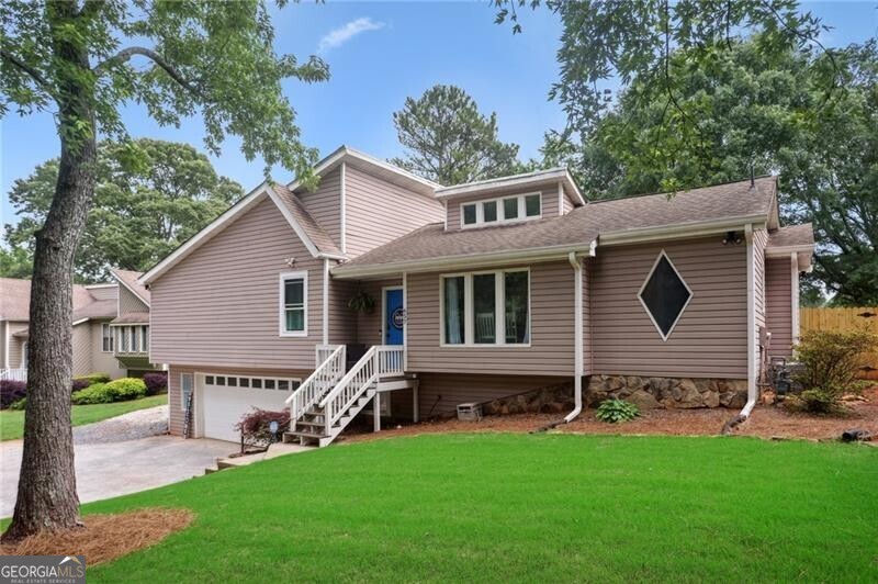 SUPER cool/hip/funky contemporary with a brand new kitchen featuring white cabinets, stainless appliances and upgraded granite. West Side Elementary School district! Tall ceilings in the living space and a dramatic fireplace in the main living room. PHENOMENAL ONE YEAR OLD in-ground pool in the backyard overlooked by a beautiful covered porch and outdoor entertaining area. Full basement, partially finished into both living space and storage. Both bathrooms updated including a double vanity in the primary bathroom. New windows throughout! Backyard is fully fenced with a new privacy fence and the front yard has an irrigation system. Awesome large lot just west of the Marietta Square and close to Kennesaw Mountain and West Side Elementary.
