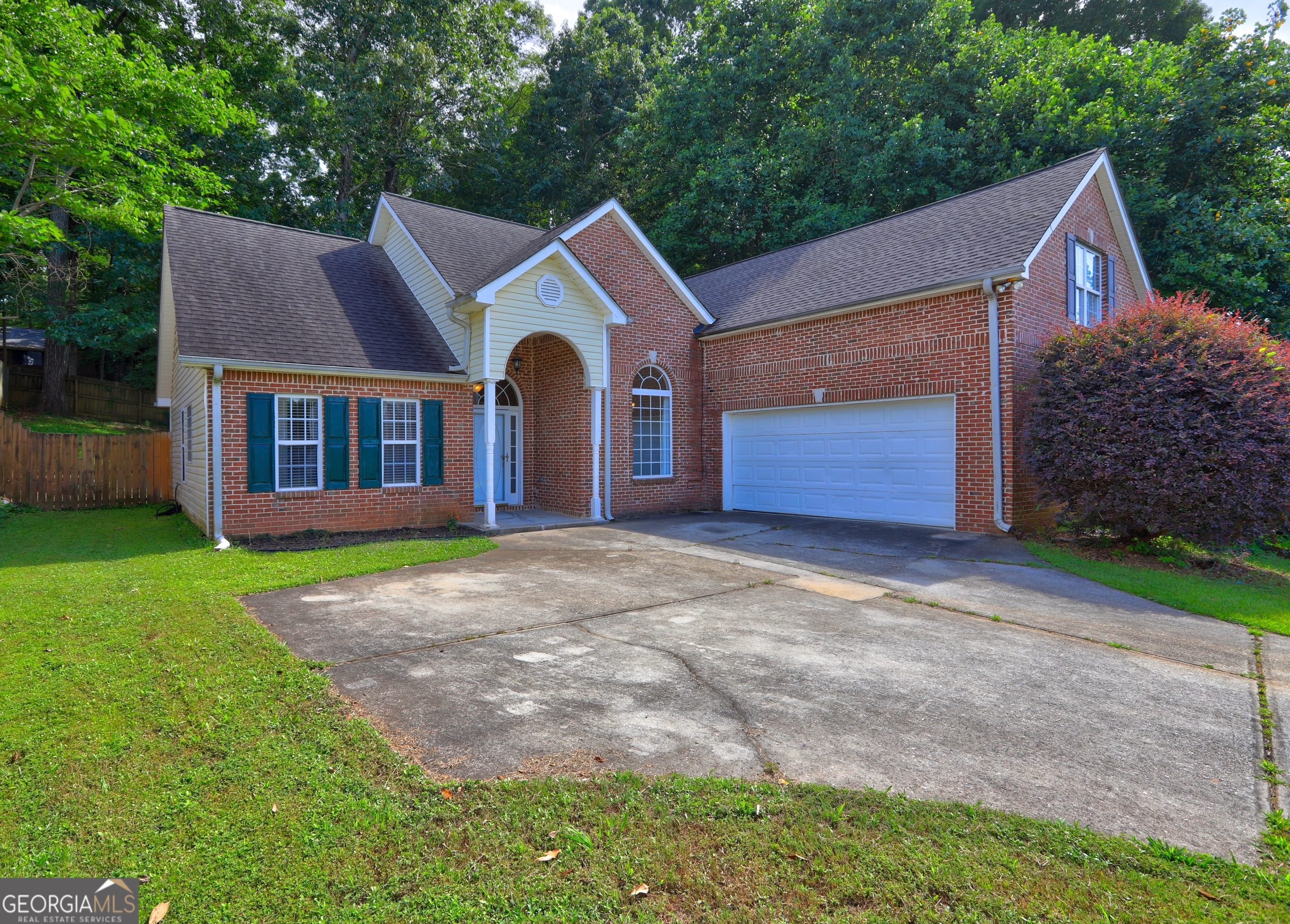 Welcome home! This 4-bedroom, 2-bathroom ranch-style residence offers spaciousness, functionality, and a flexible layout. Step inside to a bright living area with high ceilings, a cozy fireplace, and direct access to an enclosed patio overlooking the fenced backyard-perfect for relaxing or entertaining. The eat-in kitchen overlooks the living rooms, while a formal dining area adjacent to the kitchen provides additional seating. The desirable split-bedroom floor plan ensures privacy for the primary suite, featuring a walk-in closet, soaking tub, separate shower, and double vanity. Three additional bedrooms and a second full bathroom are located on the opposite side-ideal for guest rooms, a home office, or flex space. Additional highlights include a 2-car garage, a laundry room, and abundant natural light throughout. Conveniently located just minutes from I-75, only 16 miles to the Domestic Terminal and 11 miles to the International Terminal, 27 miles from Buckhead North, and just 11 miles from Bridges at Jodeco - your go-to destination for Costco, Sprouts, Chick-fil-A, and more! Proof of 1 year rental history required, no evictions or unpaid rent, favorable credit history.