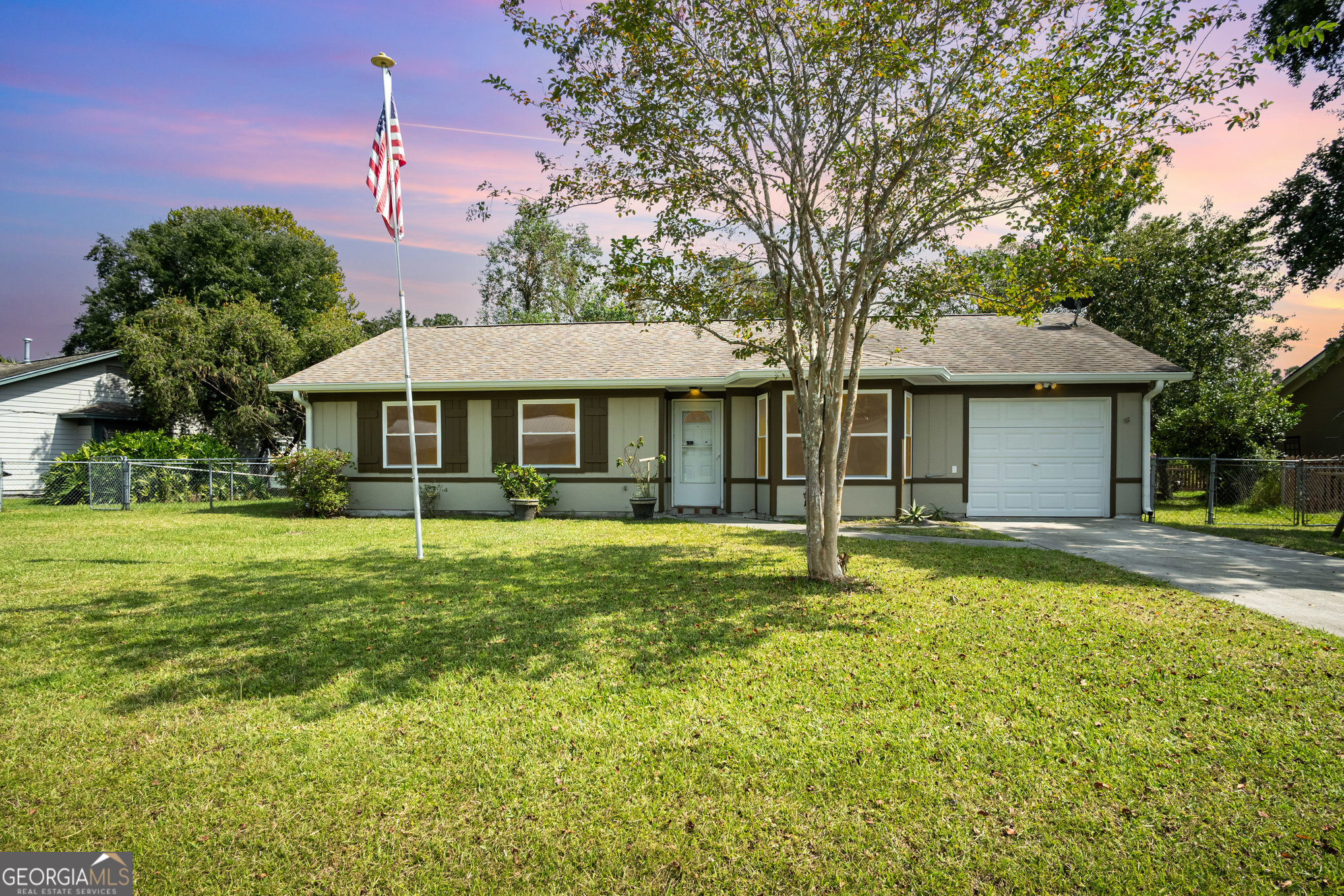 Welcome to this inviting 3-bedroom, 2-bath home nestled in a peaceful neighborhood and ready for you to move right in! Step inside to soaring ceilings and a sun-filled living area, enhanced by a beautiful bay window that opens seamlessly to the dining room and kitchen. You'll love the low-maintenance design-no carpet-with hardwood-style flooring throughout and tile in the bathrooms. The kitchen boasts stainless steel appliances, while the laundry room is conveniently located just off the kitchen. Enjoy breathtaking lake views from your back patio, complete with water access for relaxation or recreation. Major updates give peace of mind with a newer roof and HVAC system, both replaced within the last 8 years. Perfectly positioned just off I-95 (Exit 1).