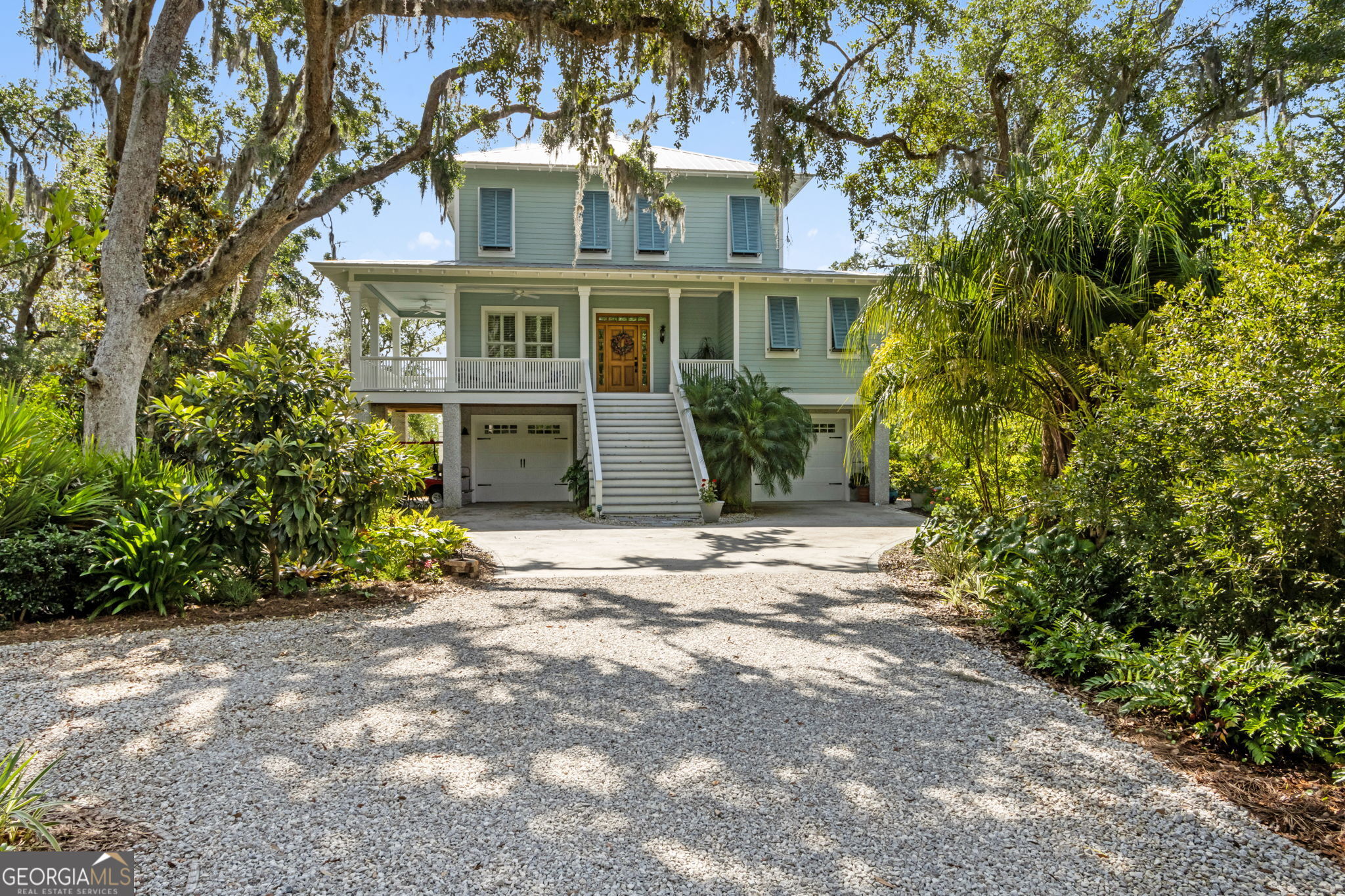 Deepwater living in Cumberland Harbour! Enjoy the coastal life in this Allison Ramsey design crafted by Terry Stover Construction. With views over to Amelia Island, Cumberland Island and the open ocean. From your private deep water dock boat over to Cumberland Island for the East Coast's most pristine beach complete with wild horses. Amelia Island is 15 minutes away via boat with great restaurants and shopping. When not living the life aquatic, enjoy all the amenities Cumberland Harbour is known for; pools, fitness, tennis, pickleball, bocce', playgrounds, day dock, kayak launch and more. All under the watchful eye of 24/7 manned gated security. The home design boasts the kitchen/living room on the top floor with incredible views. Vintage heart pine floors, metal roof, deepwater dock and tabby foundation complete the Low-Country style. Enjoy the moonrise over Cumberland Sound from the easy chair in your living room! The views are spectacular and ever changing with weather and season. Your Coastal Lifestyle starts right here, right now. Play, Relax, Explore... Cumberland Harbour.