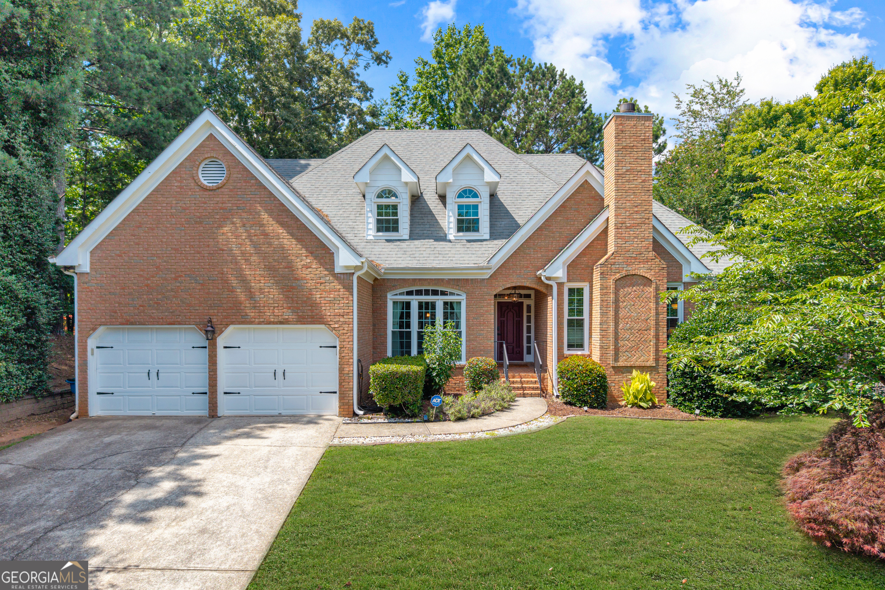Hard to find Primary bedroom and office on main level! This beautifully updated home features hardwood floors throughout the entire main level and has been freshly painted inside and out. The elegant dining room flows seamlessly into the spacious living room, while the fireside family room opens to a gourmet kitchen complete with stainless steel appliances, granite countertops, and a sunny breakfast area. The oversized main-level primary suite offers abundant natural light, and a luxury renovated bathroom boasting new cabinetry, double sinks, granite counters, a soaking tub, and a large separate shower. Upstairs, you'll find three generously sized guest bedrooms and two fully renovated bathrooms, perfect for family or visitors. The spacious back deck has access from the kitchen and the living room, and it overlooks a flat fenced backyard.