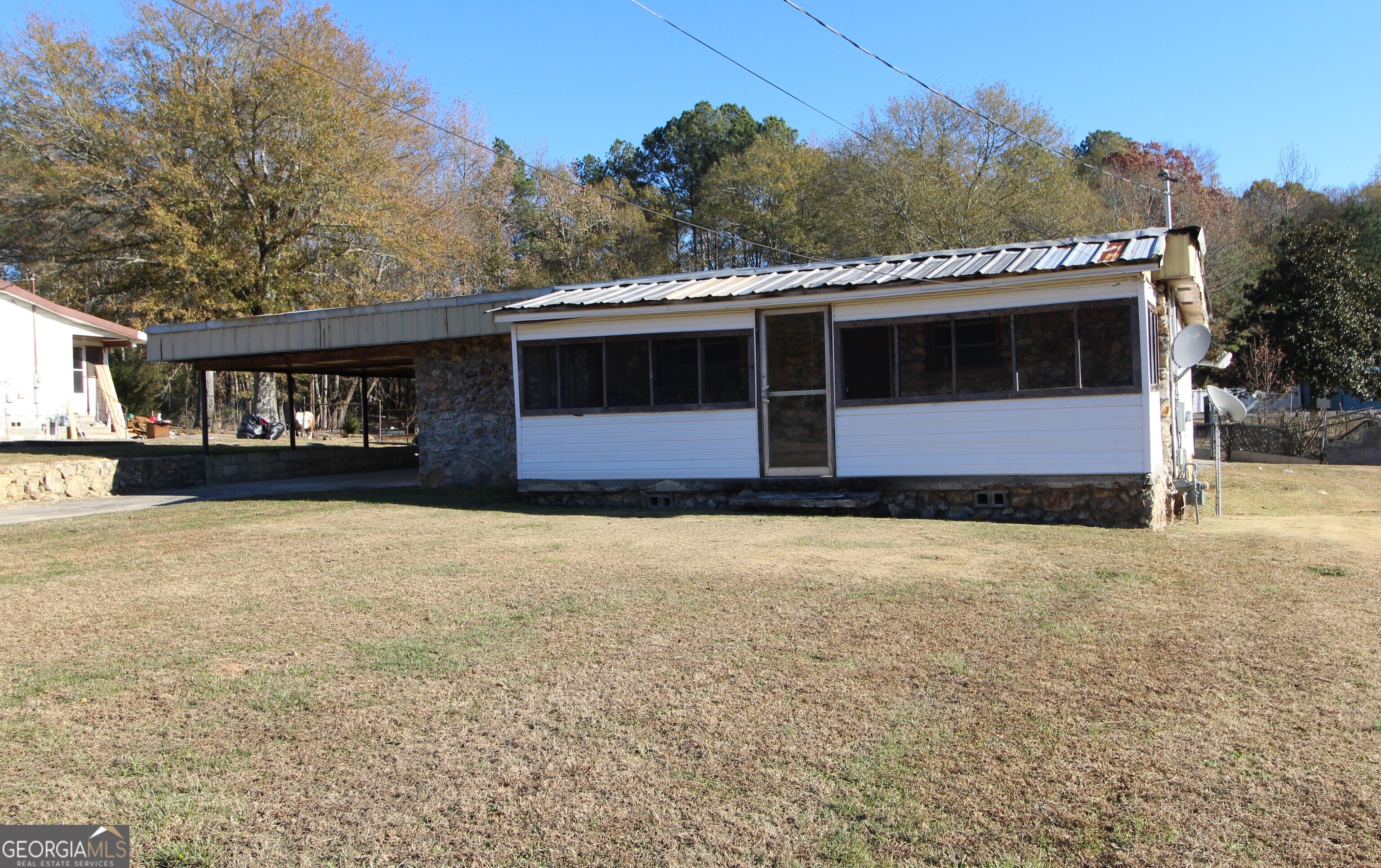 For Rent: This 2 bedroom, 2 bathroom home is ready for you! It includes a large carport, covered front porch, new LVP flooring, a living room and separate den area. In the center of the home you have a dining room that leads into the kitchen with appliances included and new countertops. One bathroom has a handicap tub. Water included in Rent. Call NOW to schedule a showing! All applications need to be submitted directly on our website at https://www.elitegroupgeorgiapropertymanagement.com/availability