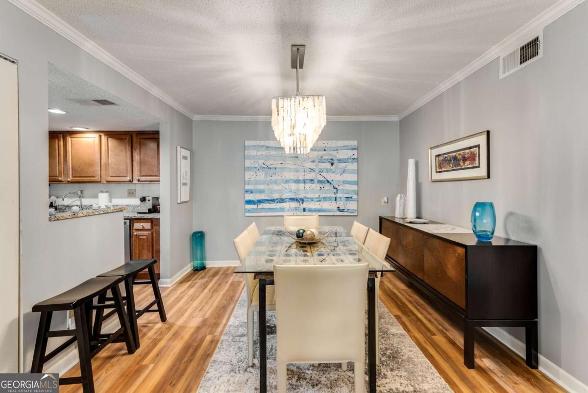 LOW HOA fees at this stunning 2 bedroom, 2 bathroom condo in the gated Highgate community in Sandy Springs. This condo has been beautifully updated with new flooring, fresh paint, and a new HVAC system (interior and exterior). The stepless unit is located in a gated community, providing both security and convenience. The area offers easy access to GA-400 and I-285, and is close to several prestigious schools, including The Art Institute of Atlanta, Argosy University, and Georgia Perimeter College. Additionally, MARTA is nearby for effortless commuting. The condo includes one assigned parking spot with plenty of guest parking available, and residents can enjoy the community pool, fitness center, clubhouse, dog park, and manicured landscaping with Low HOA fees.
