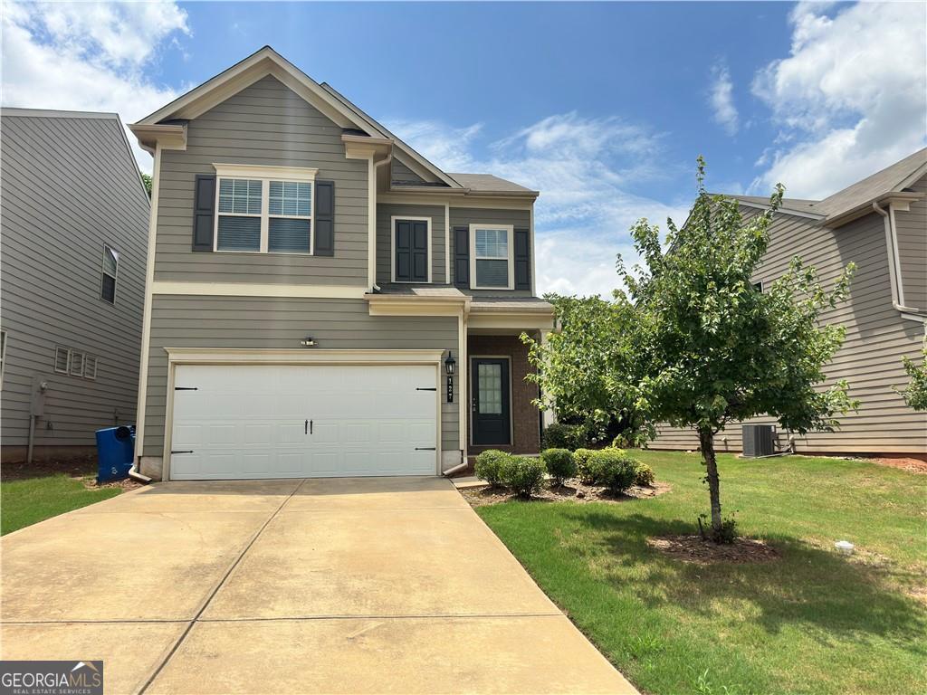 Welcome to 127 Charcoal ivys drive . 4 beds/2.5 baths 2019 kind new home! Open floor plan features ,open welcome foyer at the entrance ,The open-concept kitchen,(kitchen bar) dining, and living areas create great space, for relaxing and enjoyable atmosphere. The first floor features hardwood floor, open kitchen. second floor fully upgraded the NEW luxury LVP flooring and stair . The second level houses all 4 roomy bedrooms, most with high or trey ceilings. The owner's suite features a huge walk-in closet, separate shower/soaking tub, as well as double vanities. The Springs at Rockhouse is unique in that all your yard maintenance is included in the $750 annual dues. The community also features a stunning pool & clubhouse, tennis courts & a playground. This popular neighborhood is in close proximity to Highway 316 and is convenient to nearby parks, schools, shopping & restaurants. Great gwinnett school area. NO RENTAL RESTRICTION!! Great opportunity for resident or investor !