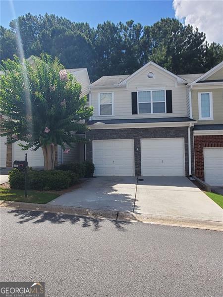 Beautifully spacious 3BR/2.5BA townhouse in sought-after Barrett Creek! Features a 2-story foyer, high ceilings, hardwood floors, and family room with gas fireplace. Kitchen offers black appliances, gas stove, pantry, and view to family room. Oversized primary suite with double vanity, soaking tub & separate shower. Spacious secondary bedrooms as well! 2-car garage, private backyard, upstairs laundry. Kindly remove shoes or use provided shoe covers when entering the homes' upstairs / carpet. NO PETS. Community pool, clubhouse & playground. Prime location minutes to I-575/75, Barrett Pkwy, shopping & dining. Move-in ready-won't last long! Lease $2,750/month.